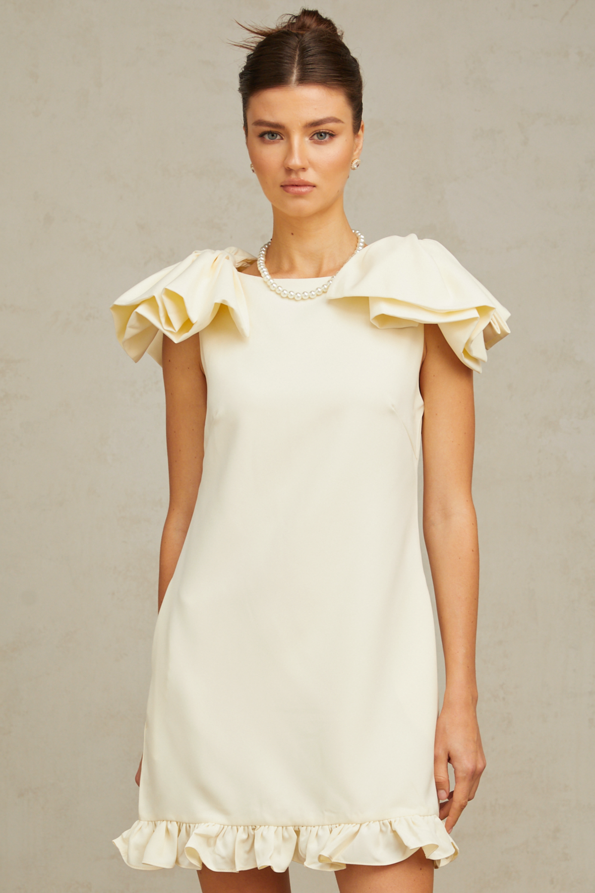 Constance white bow ruffled mini dress