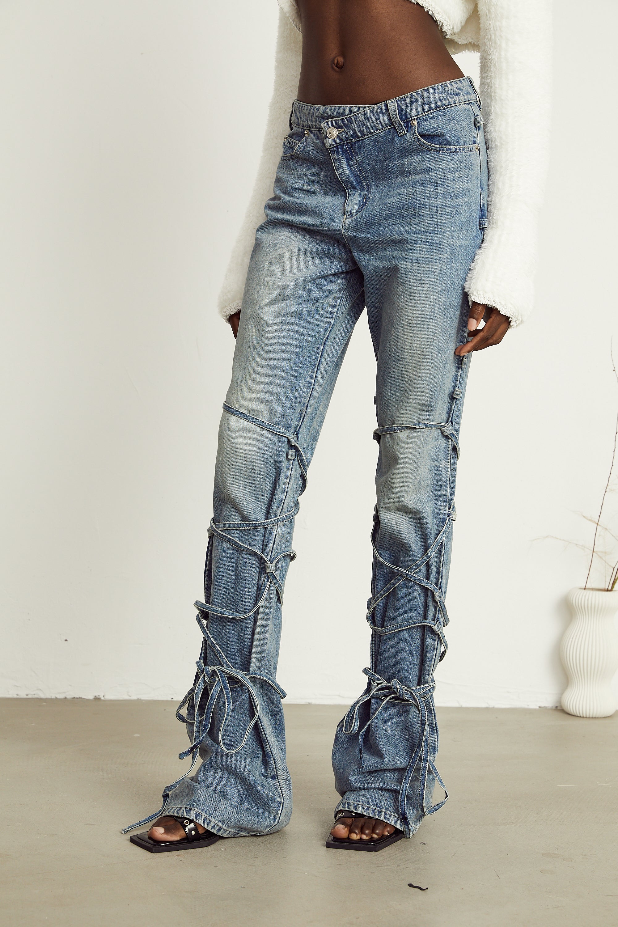 Géraldine strap-detail jeans (Final Sale-US Only)