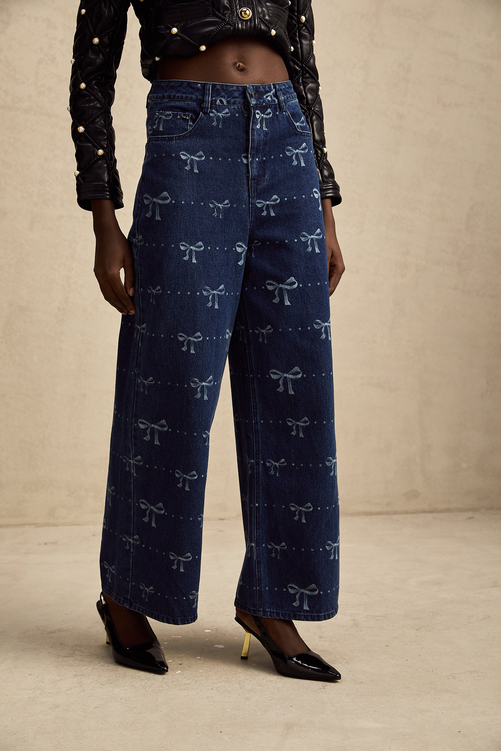 Yvonne bow-motif wide-leg jeans