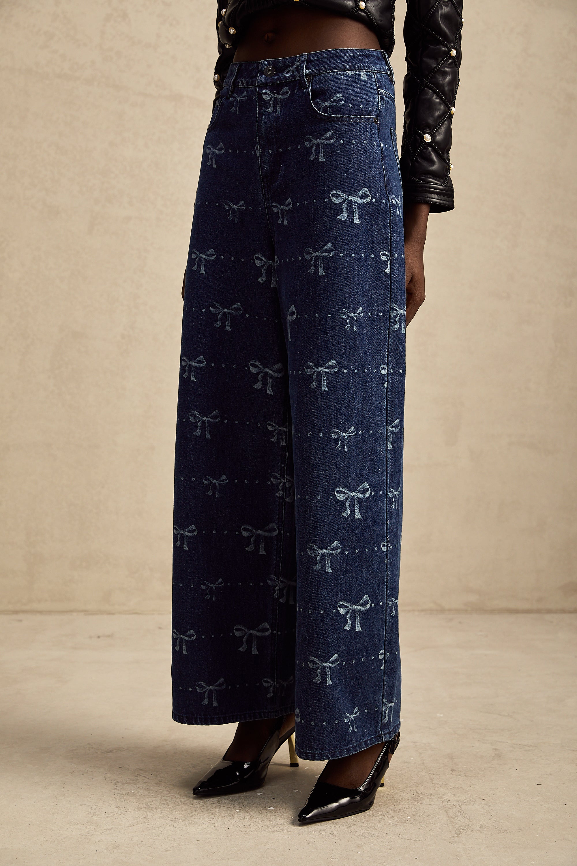 Yvonne bow-motif wide-leg jeans