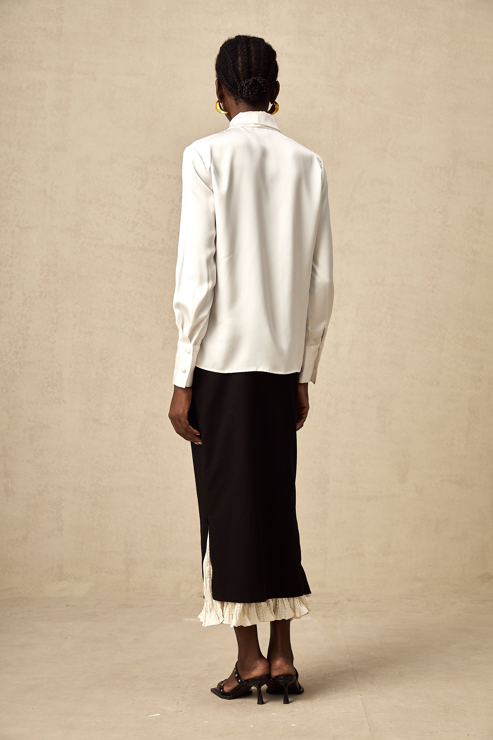 Héloïse color-blocked panelled midi skirt