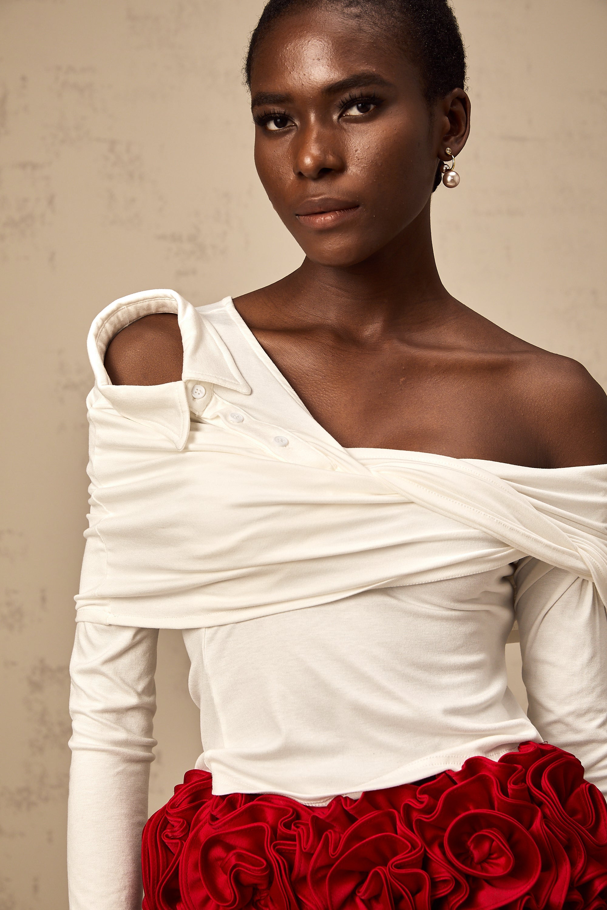 Zoéline white asymmetrical twisted jersey top
