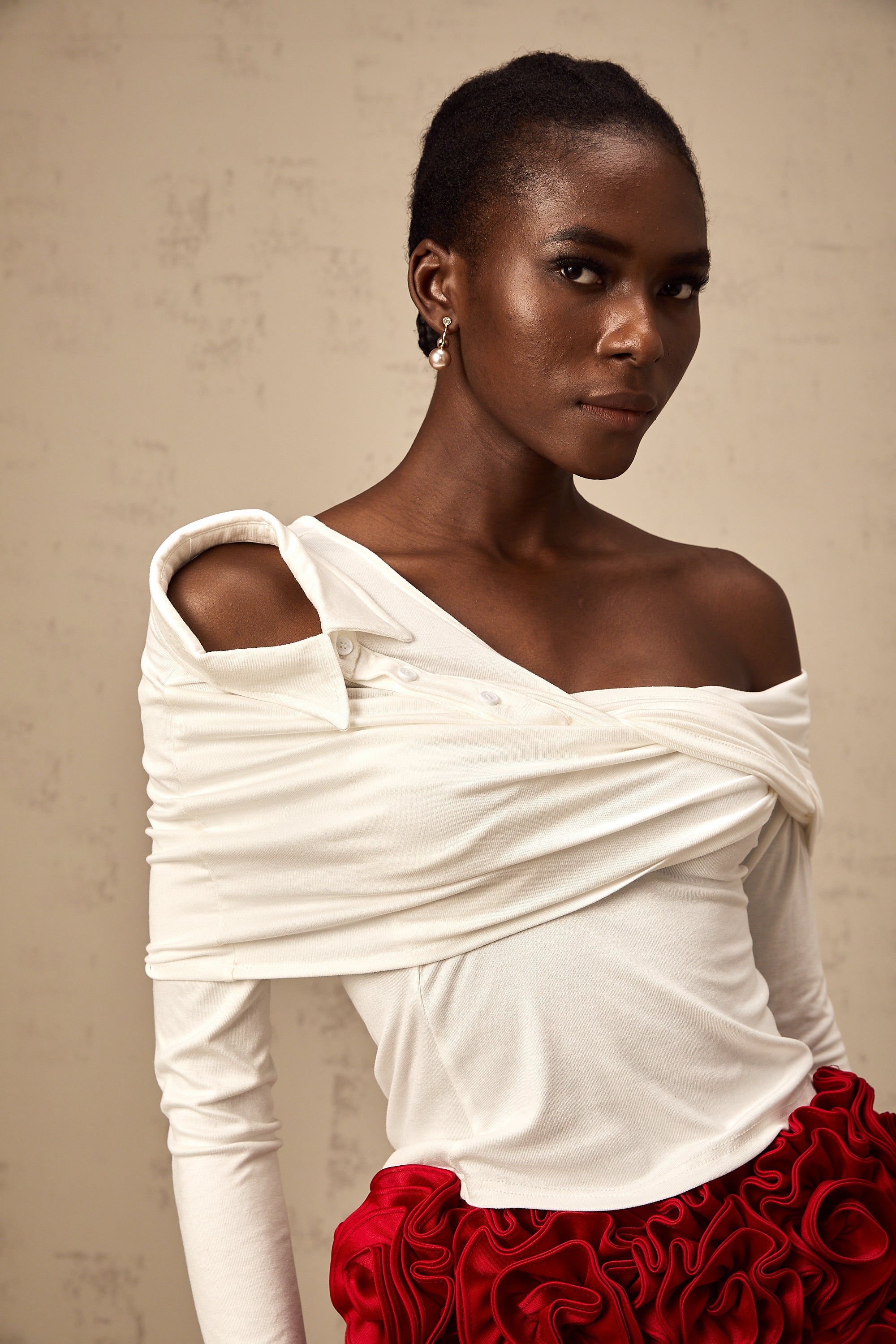 Zoéline white asymmetrical twisted jersey top