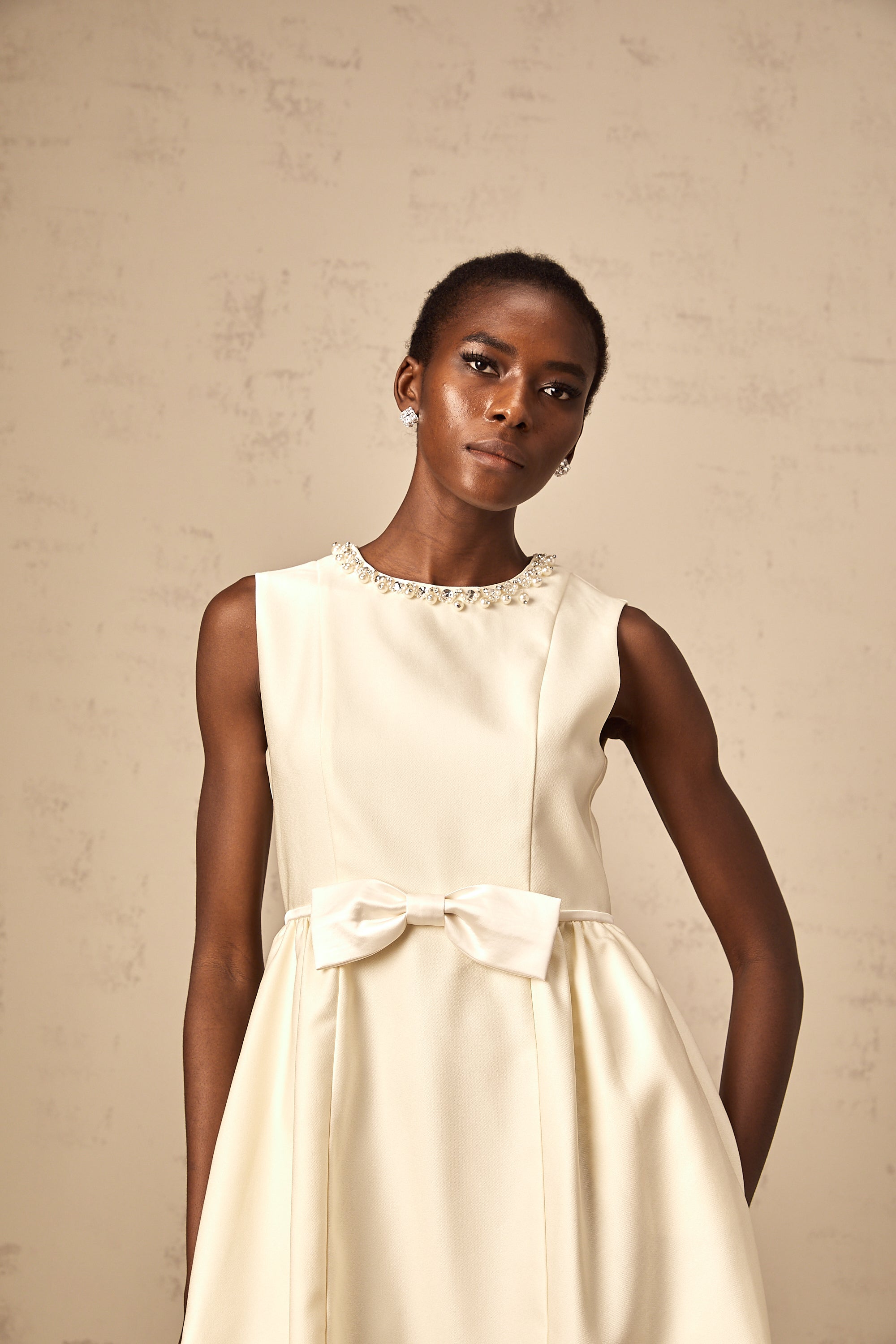 Isabelle white bowknot embellished mini dress