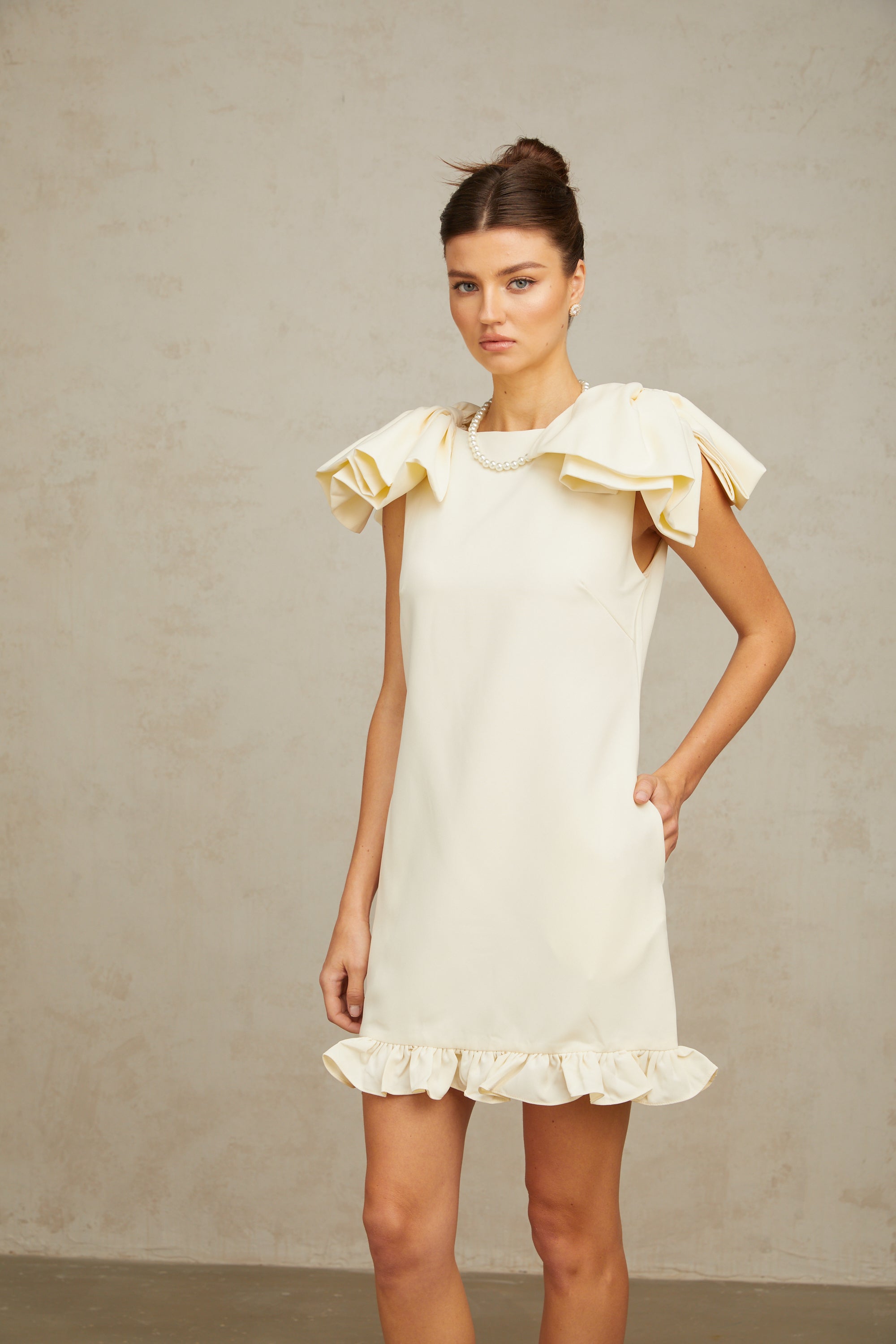 Constance white bow ruffled mini dress
