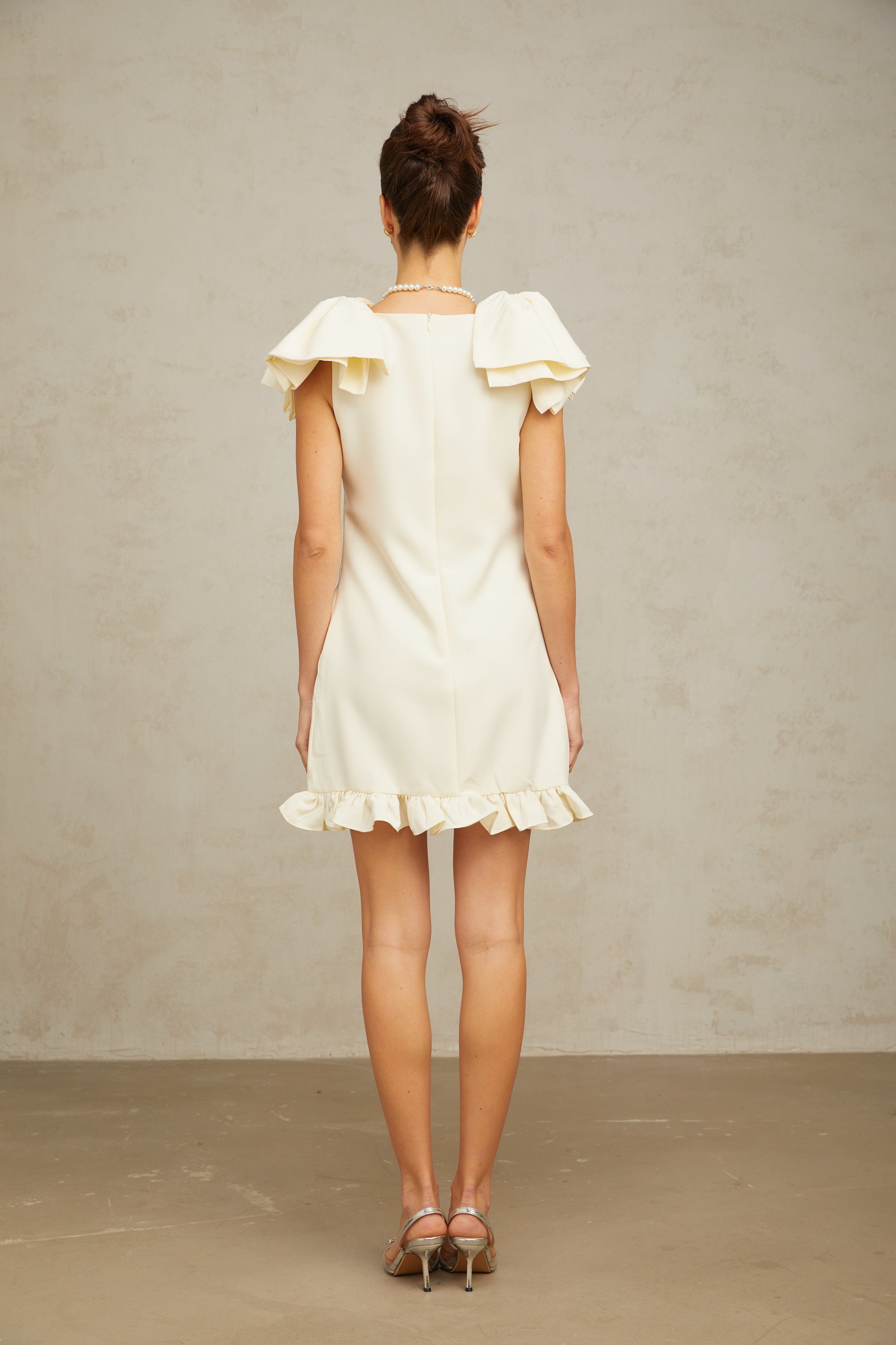 Constance white bow ruffled mini dress