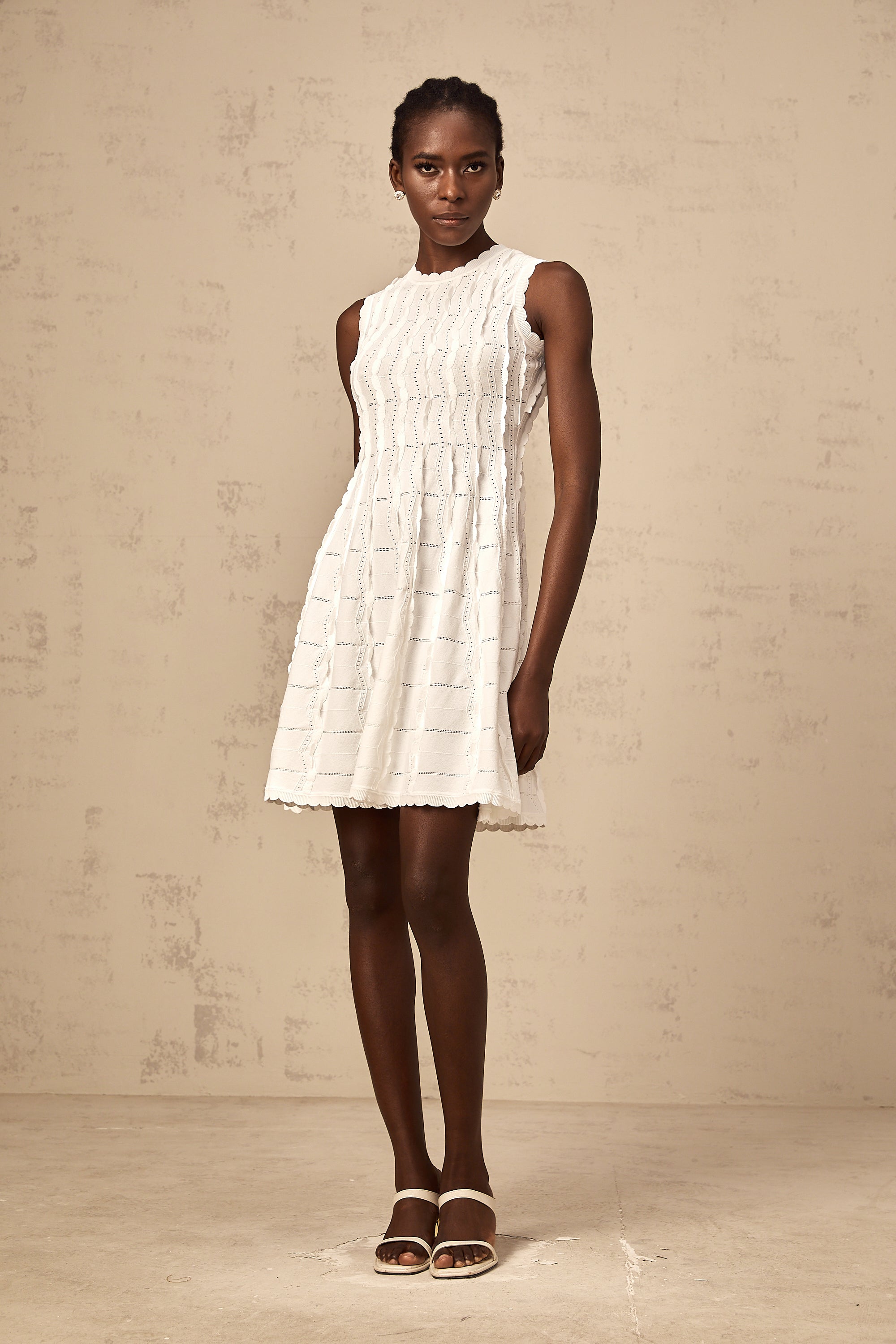 Esmée white ruffled sleeveless knit mini dress