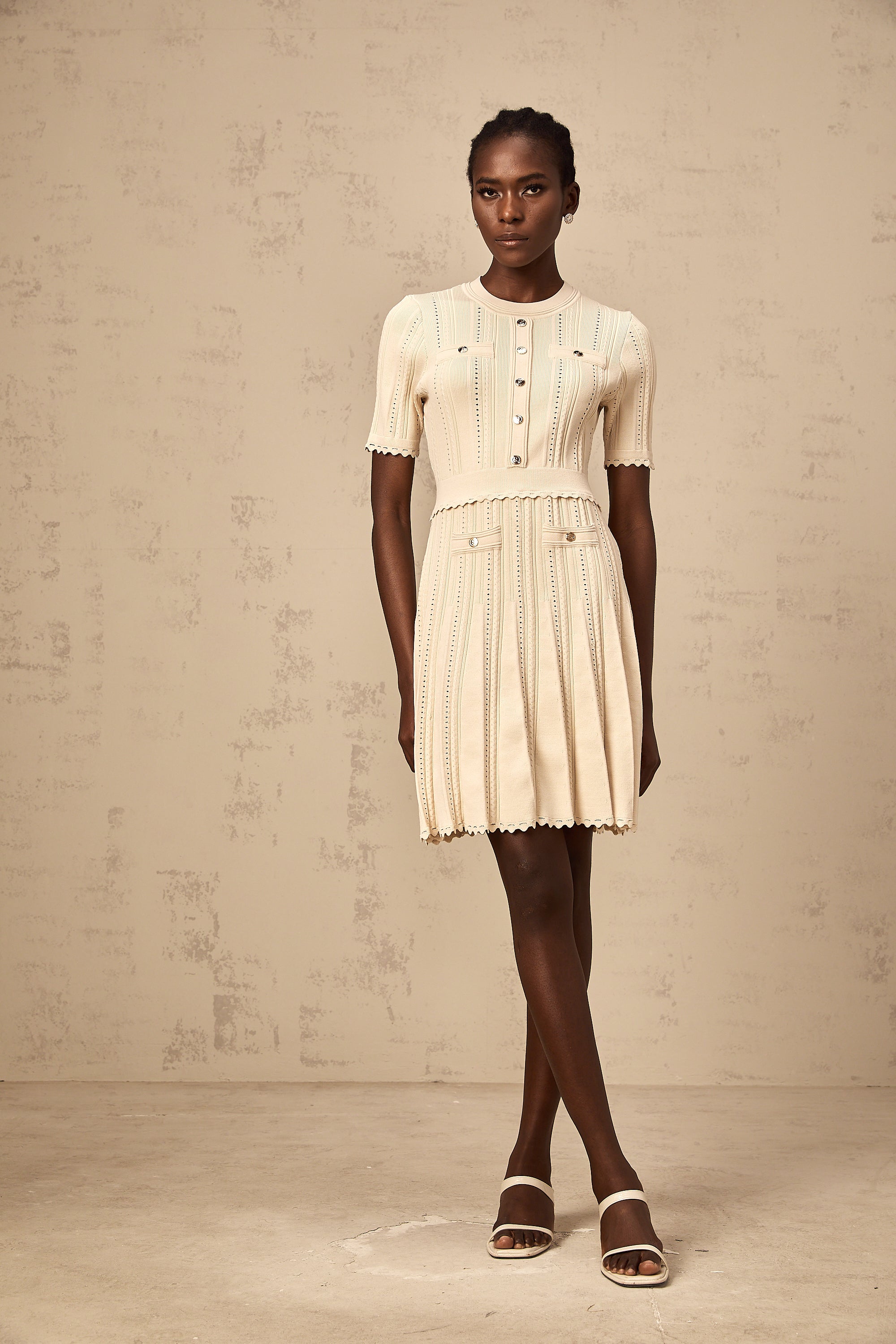 Amélie neutrals pointelle-trim pleated knit mini dress