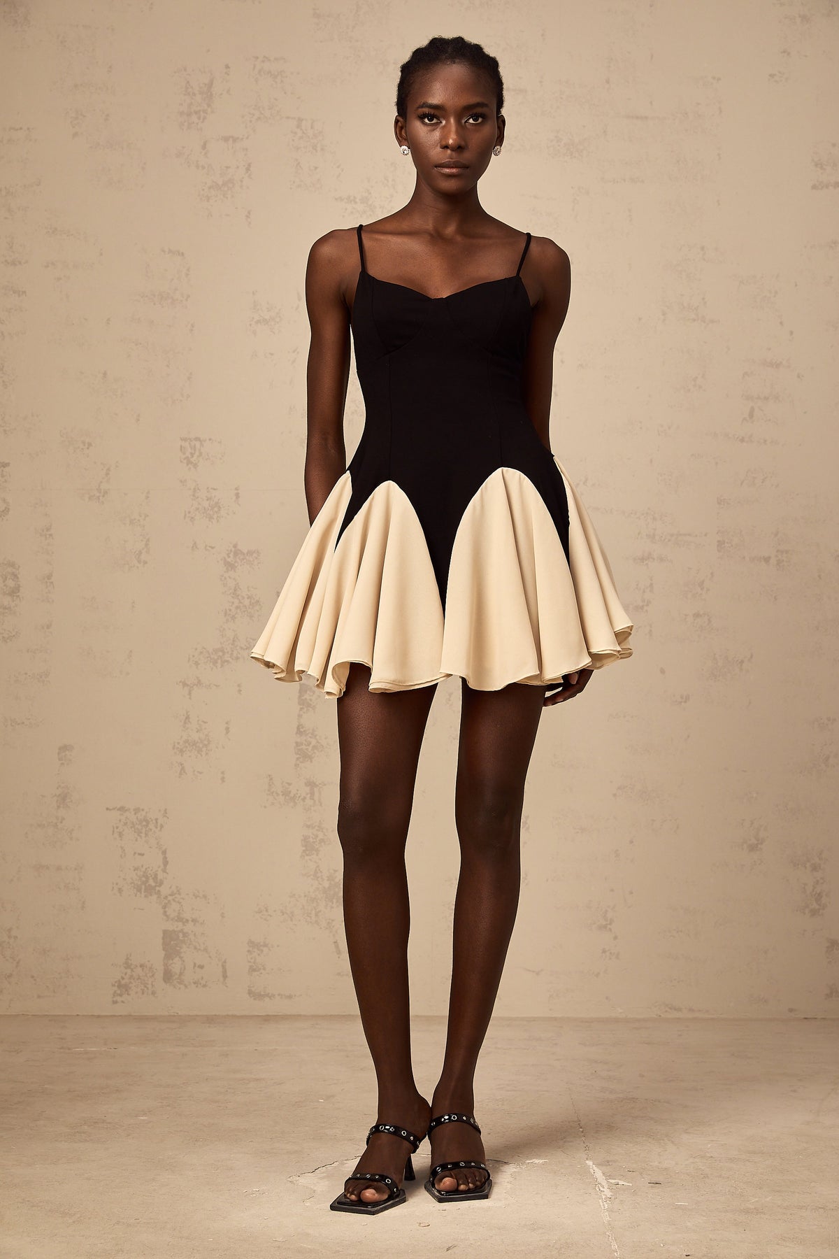 Justine color-blocked godet pleated mini dress