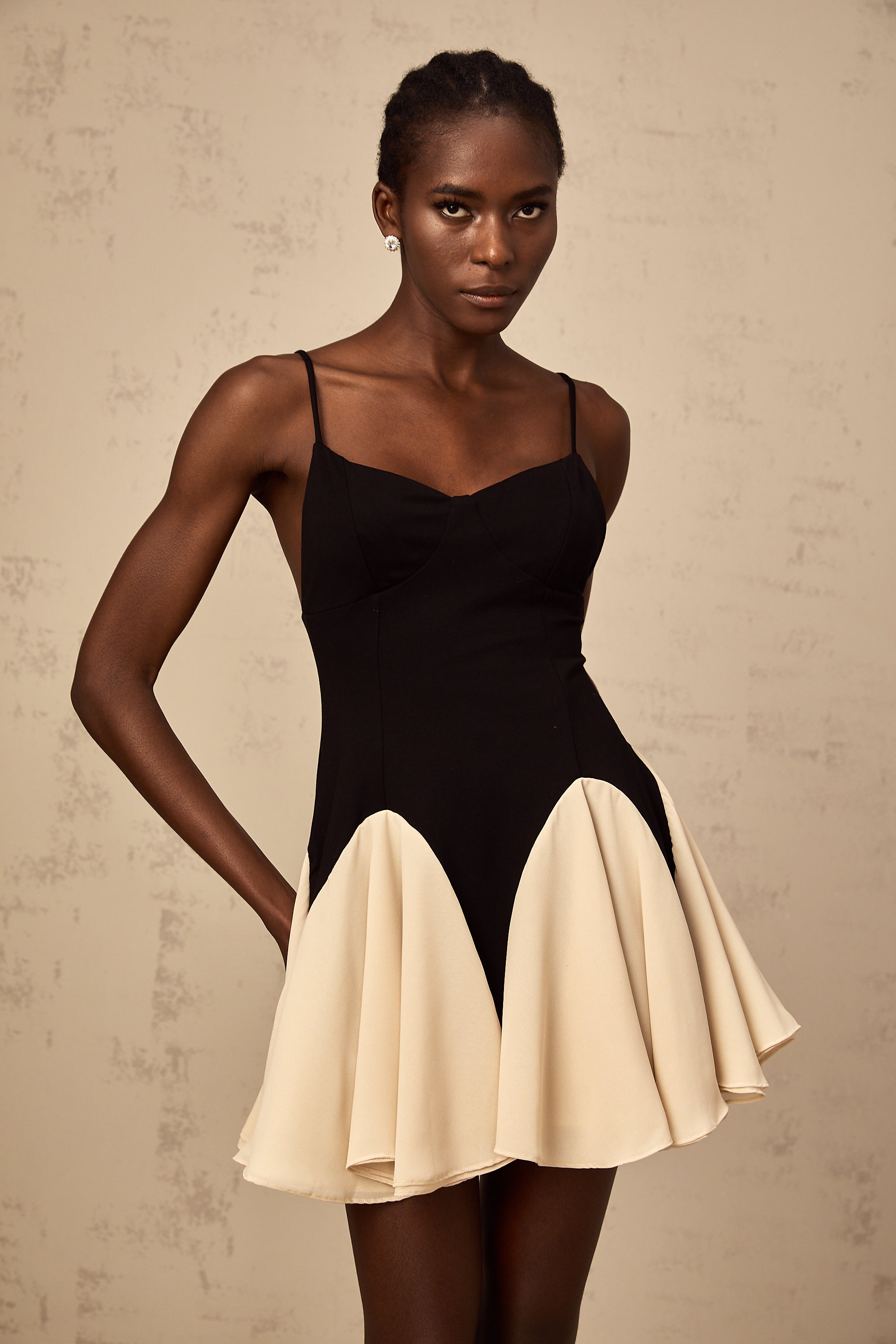 Justine color-blocked godet pleated mini dress