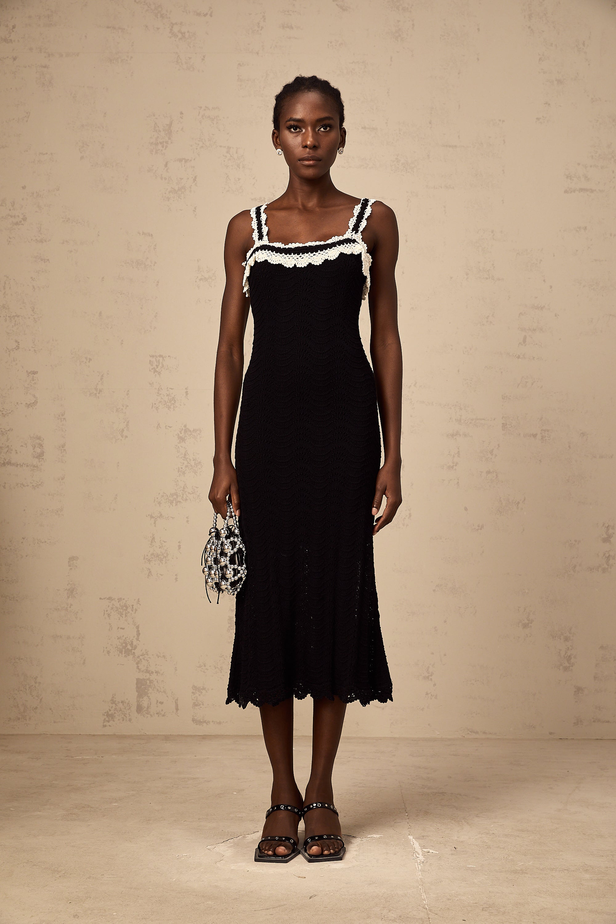 Noémie black sleeveless crochet-knit midi dress
