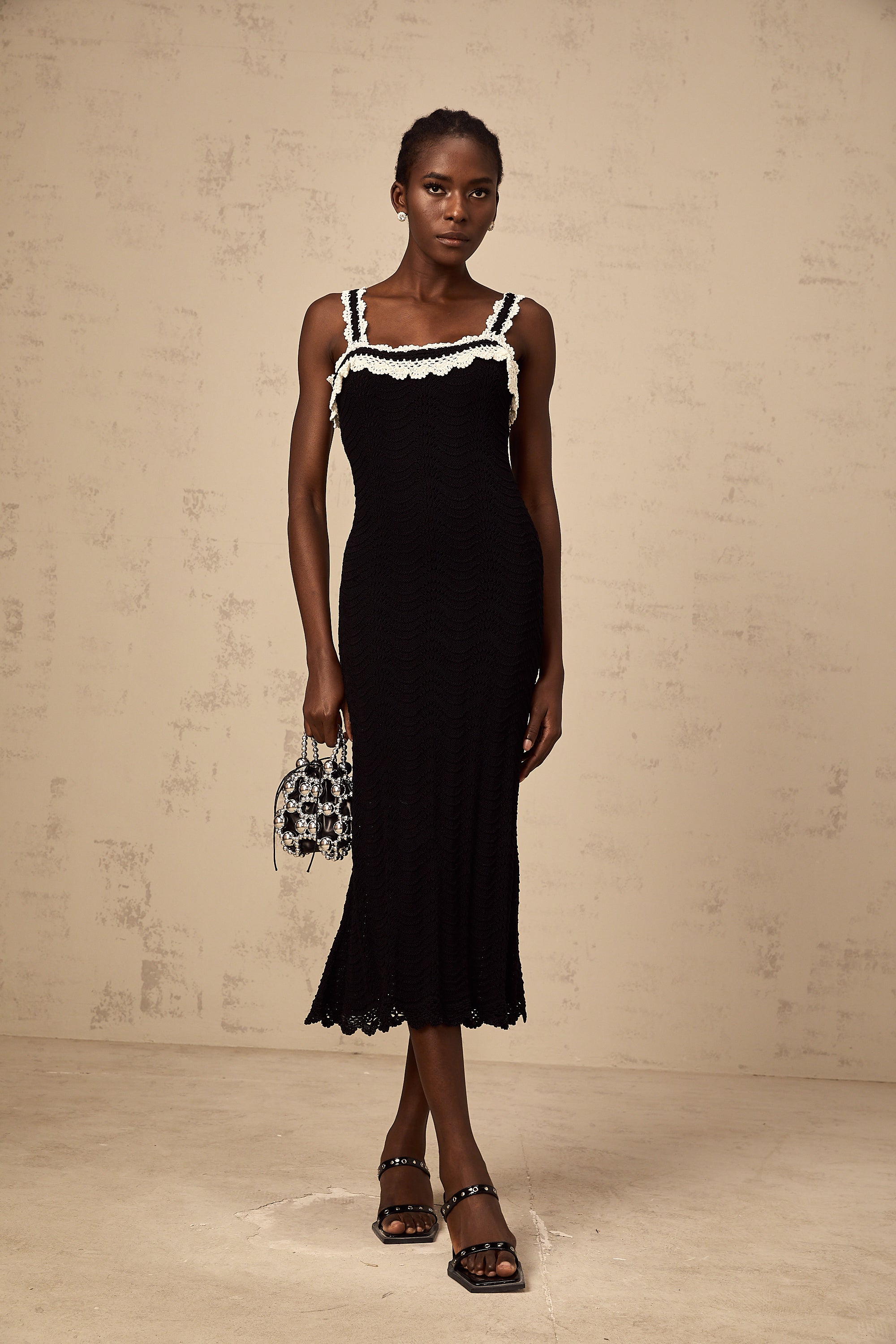 Noémie black sleeveless crochet-knit midi dress