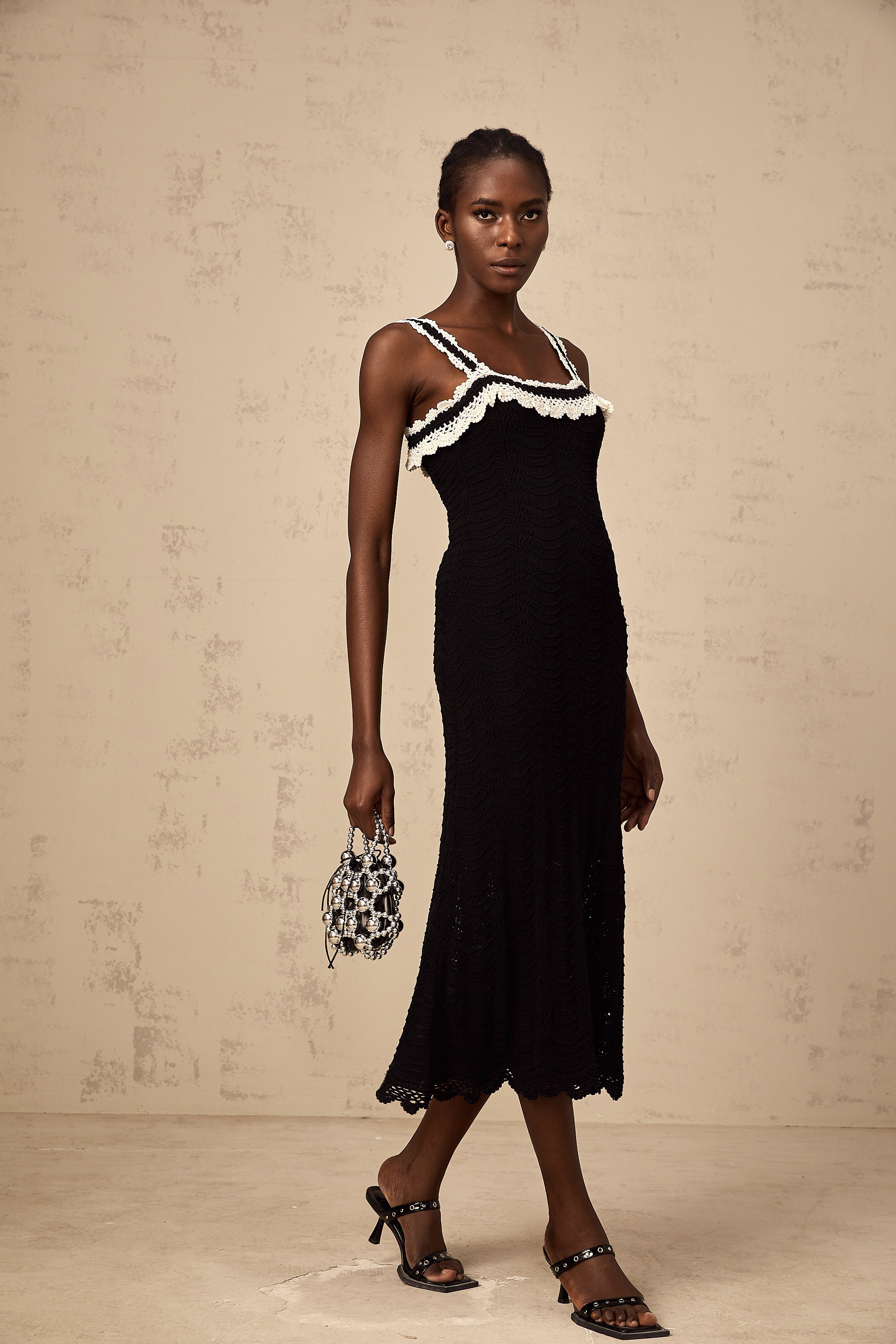 Noémie black sleeveless crochet-knit midi dress