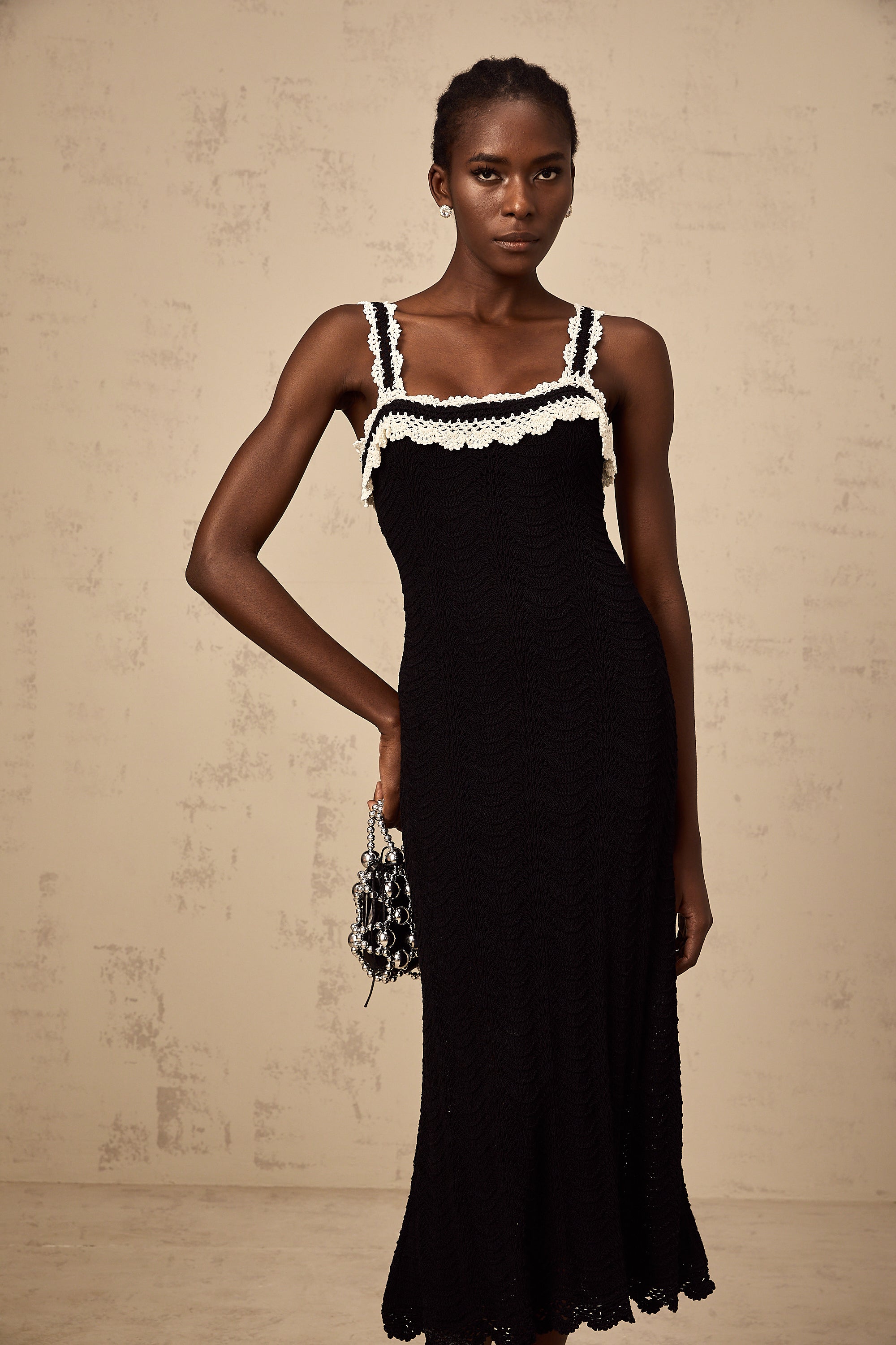 Noémie black sleeveless crochet-knit midi dress