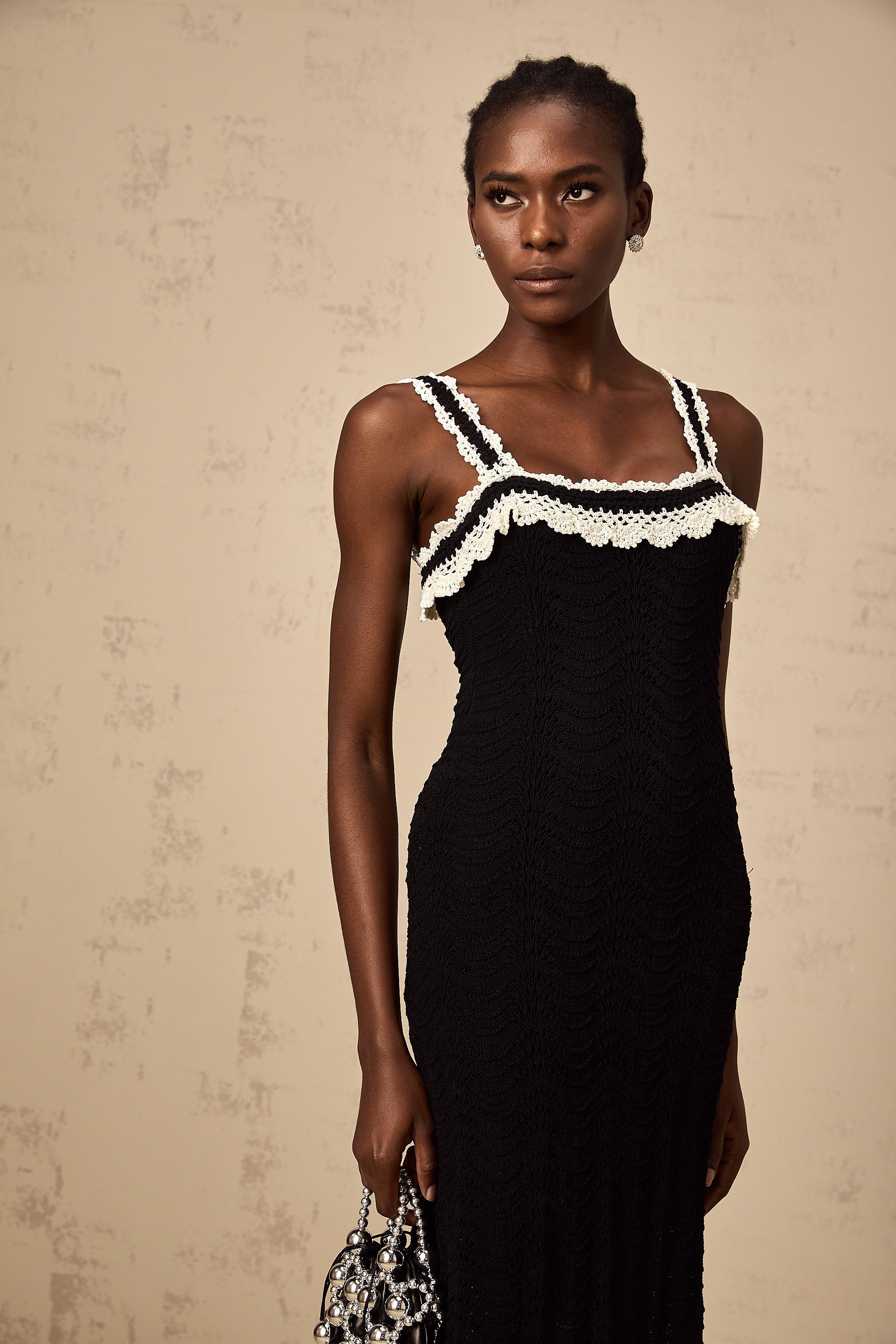 Noémie black sleeveless crochet-knit midi dress