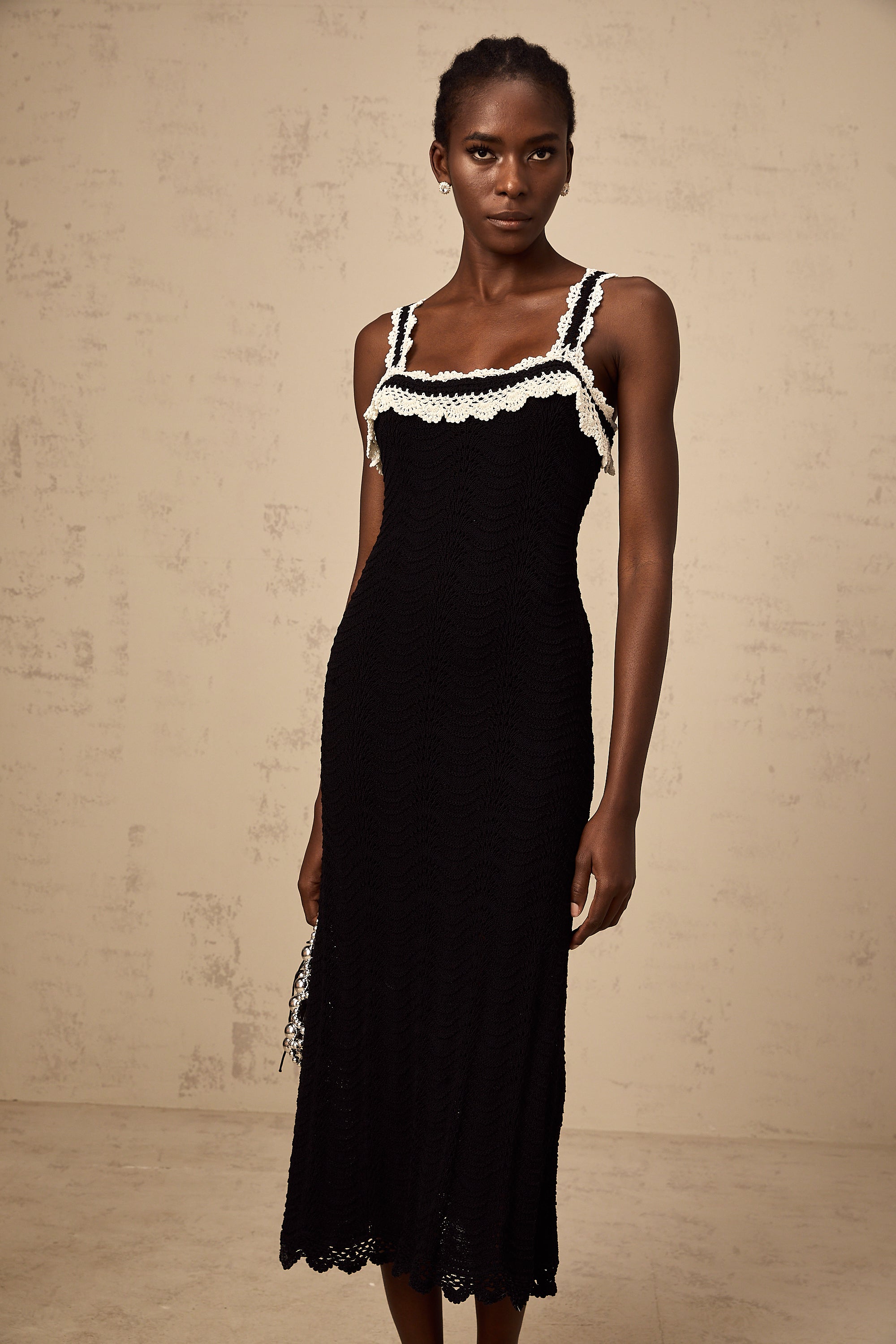 Noémie black sleeveless crochet-knit midi dress