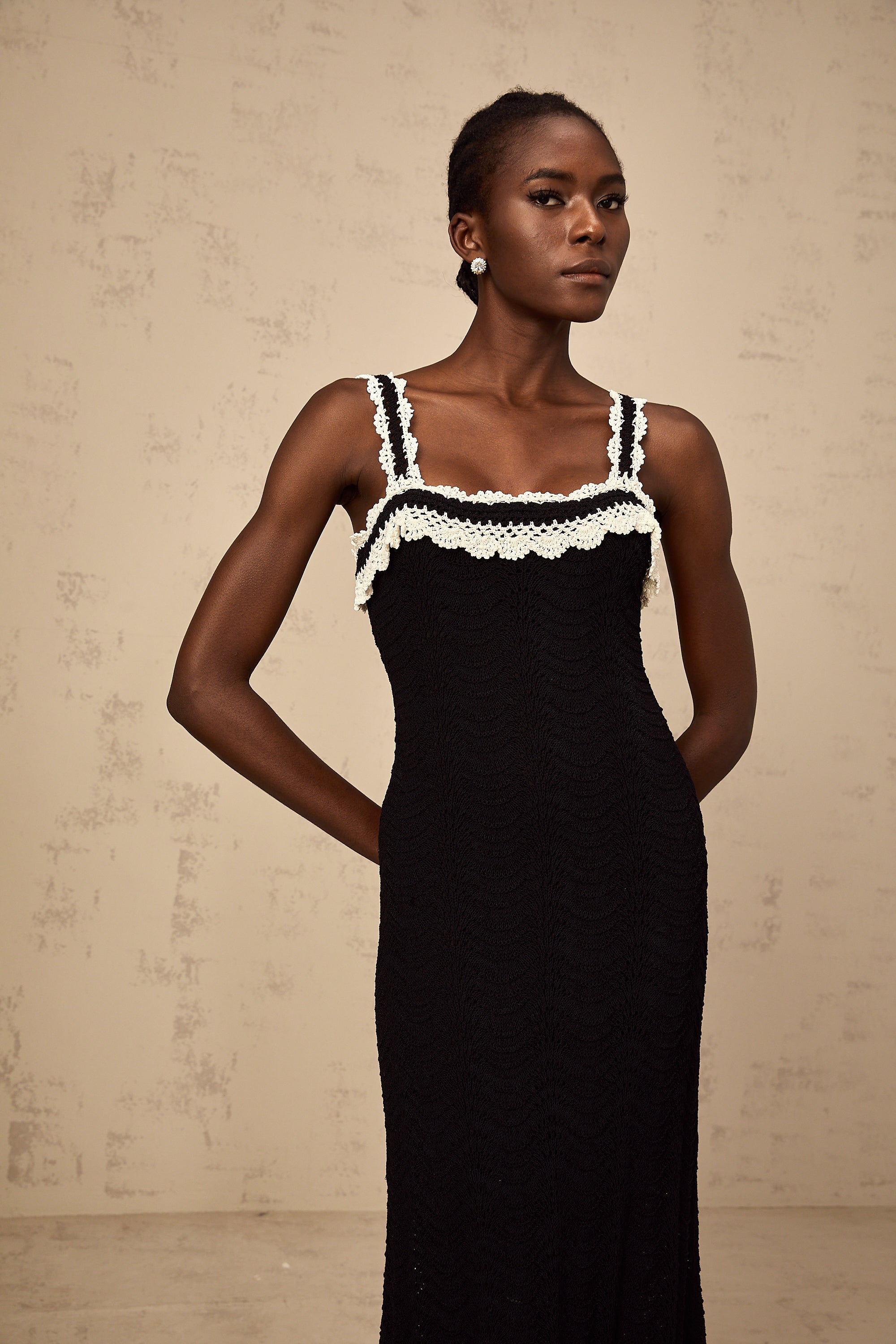 Noémie black sleeveless crochet-knit midi dress