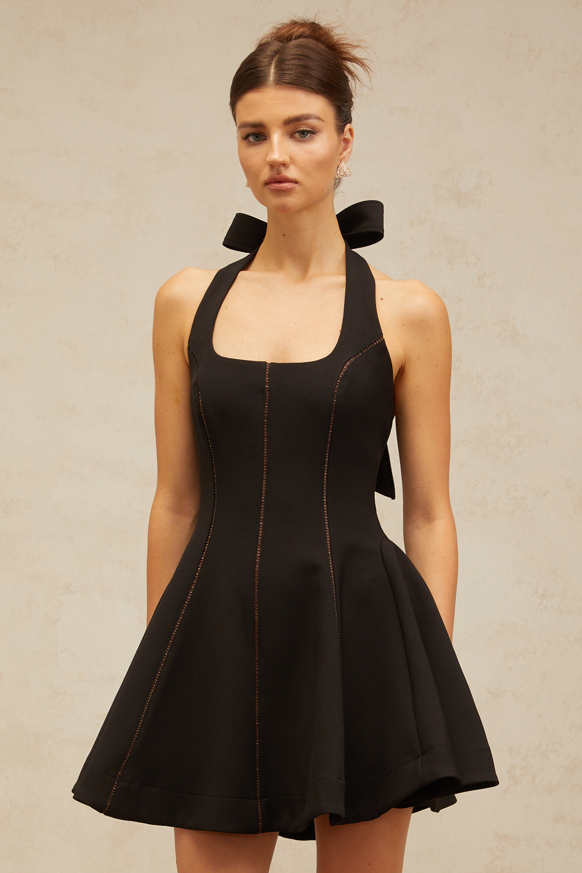 Quirine halterneck bow-detail mini dress in Black