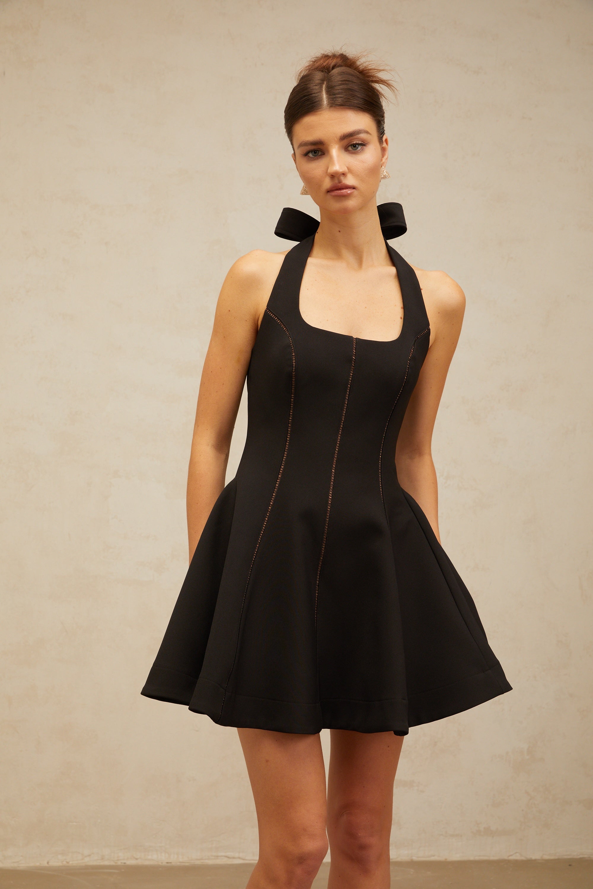Quirine halterneck bow-detail mini dress in Black