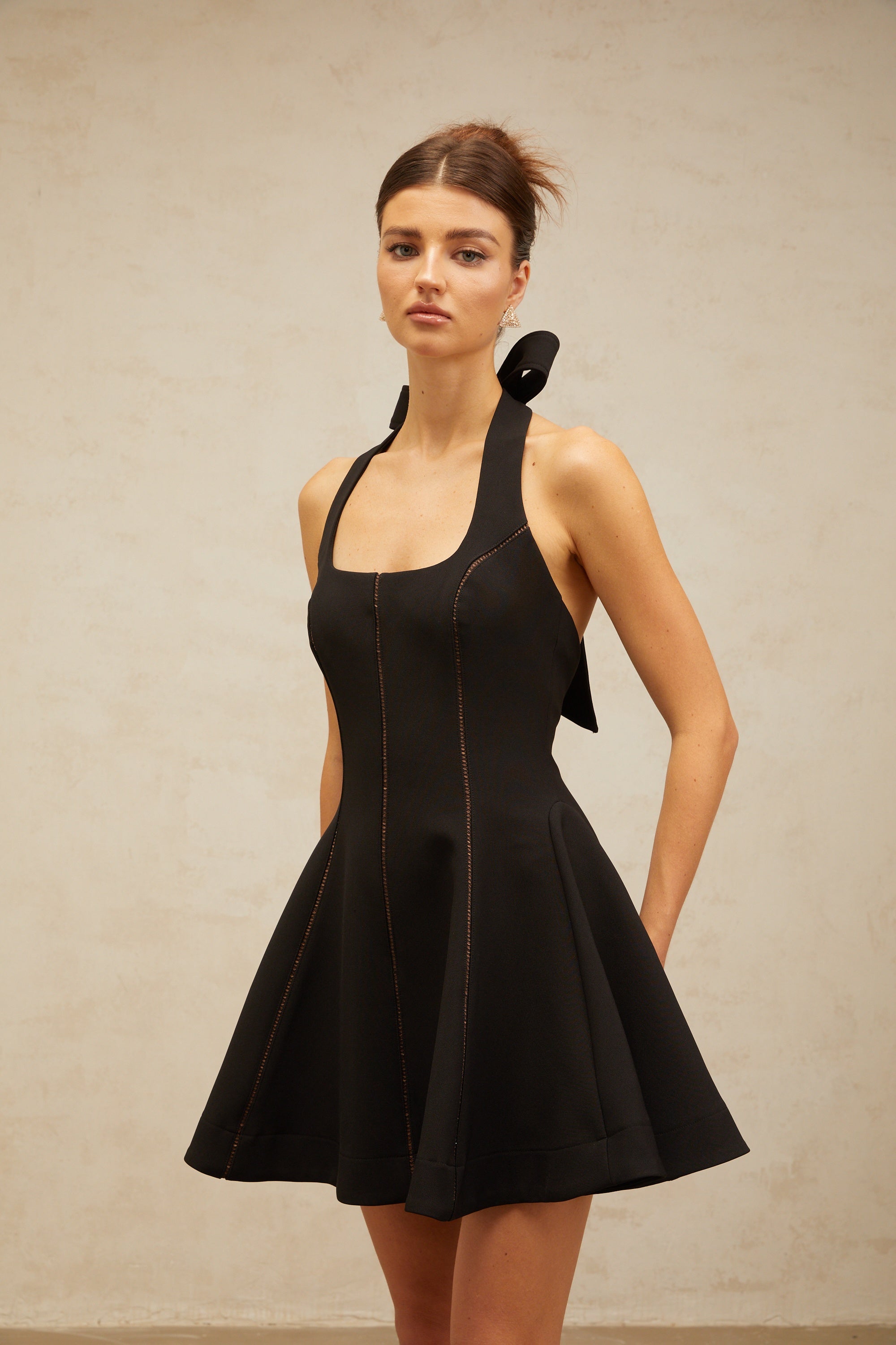 Quirine halterneck bow-detail mini dress in Black