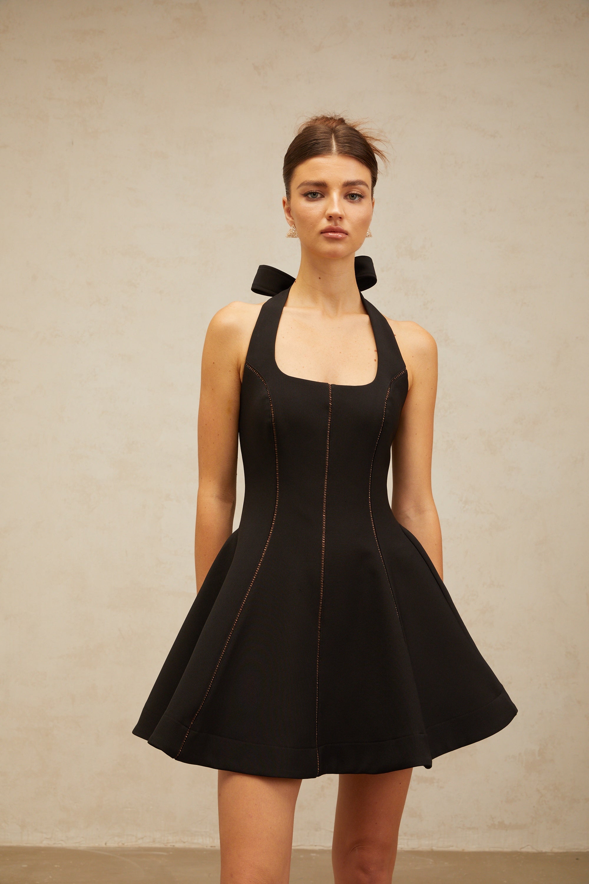 Quirine halterneck bow-detail mini dress in Black