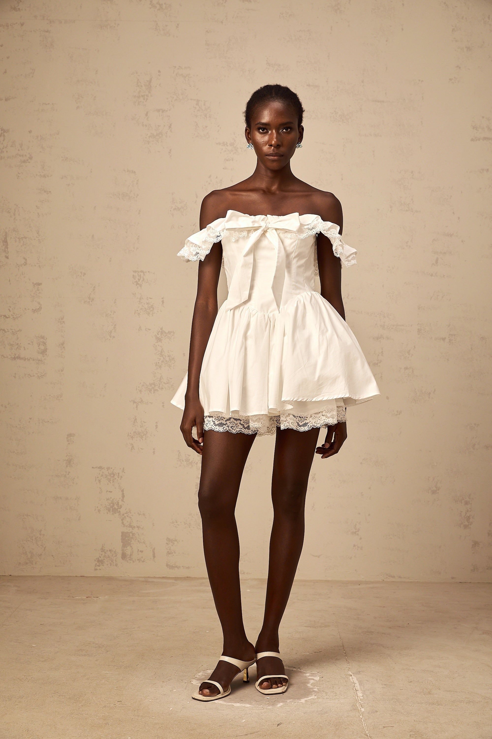 Arsène white oversize-bow ruffled mini dress