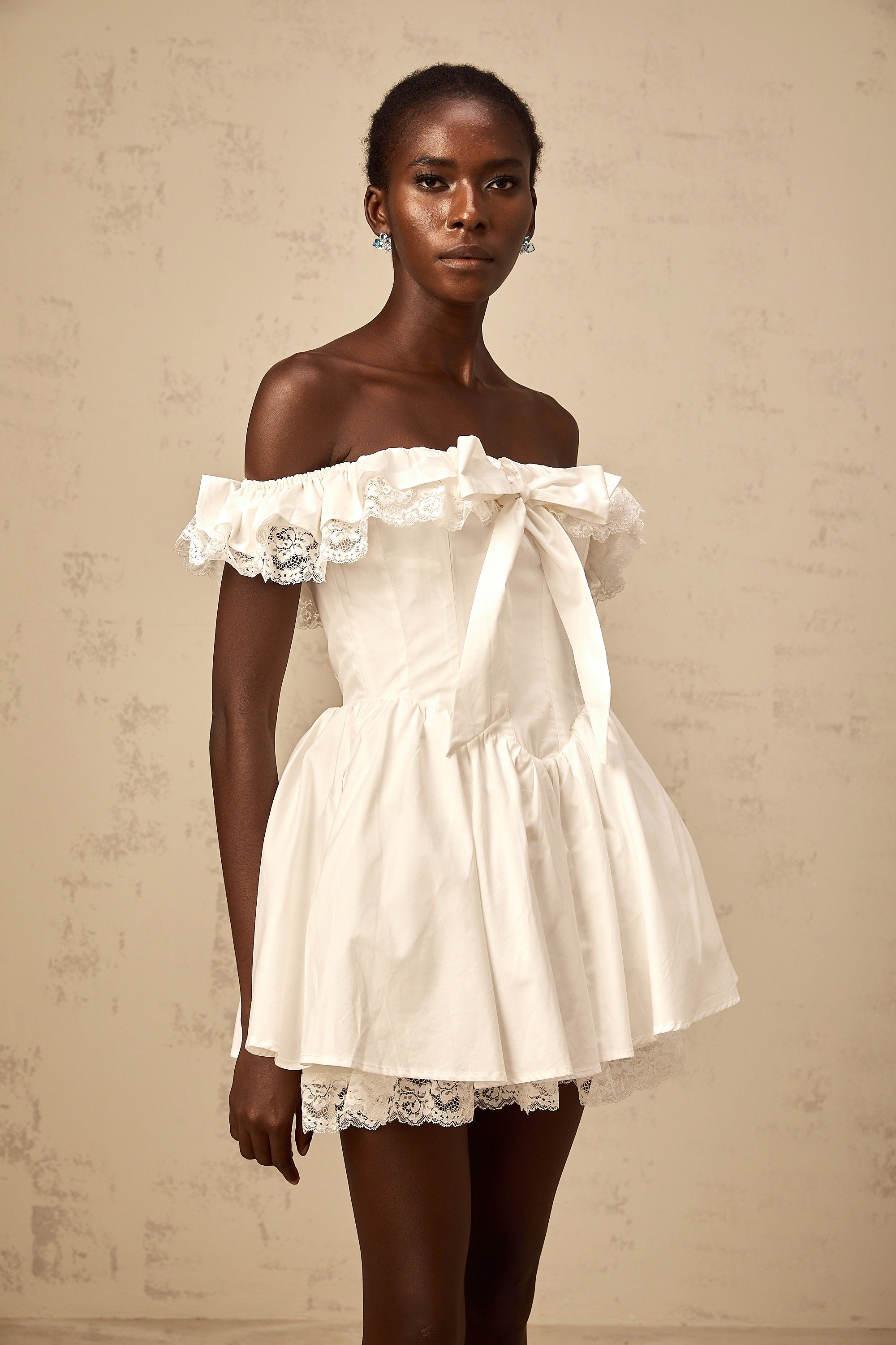 Arsène white oversize-bow ruffled mini dress