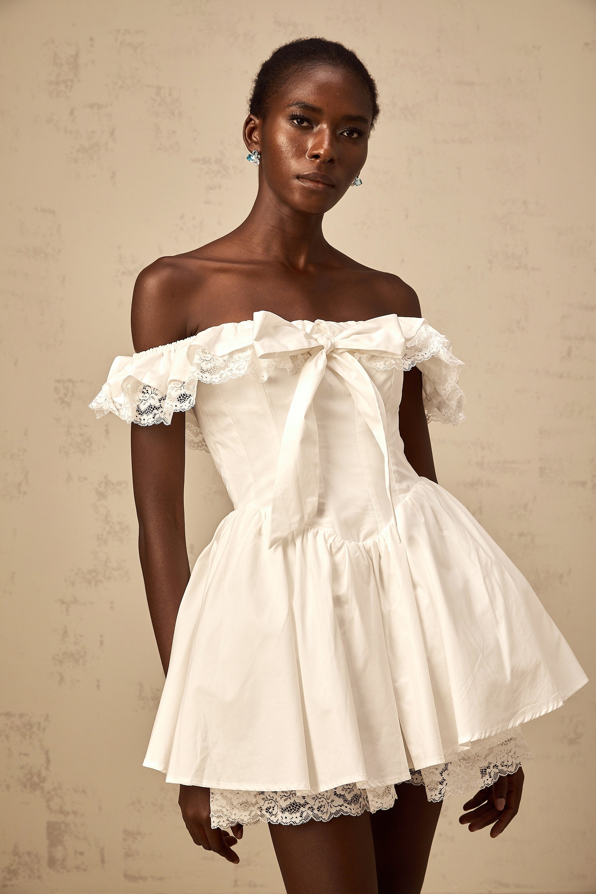 Arsène white oversize-bow ruffled mini dress