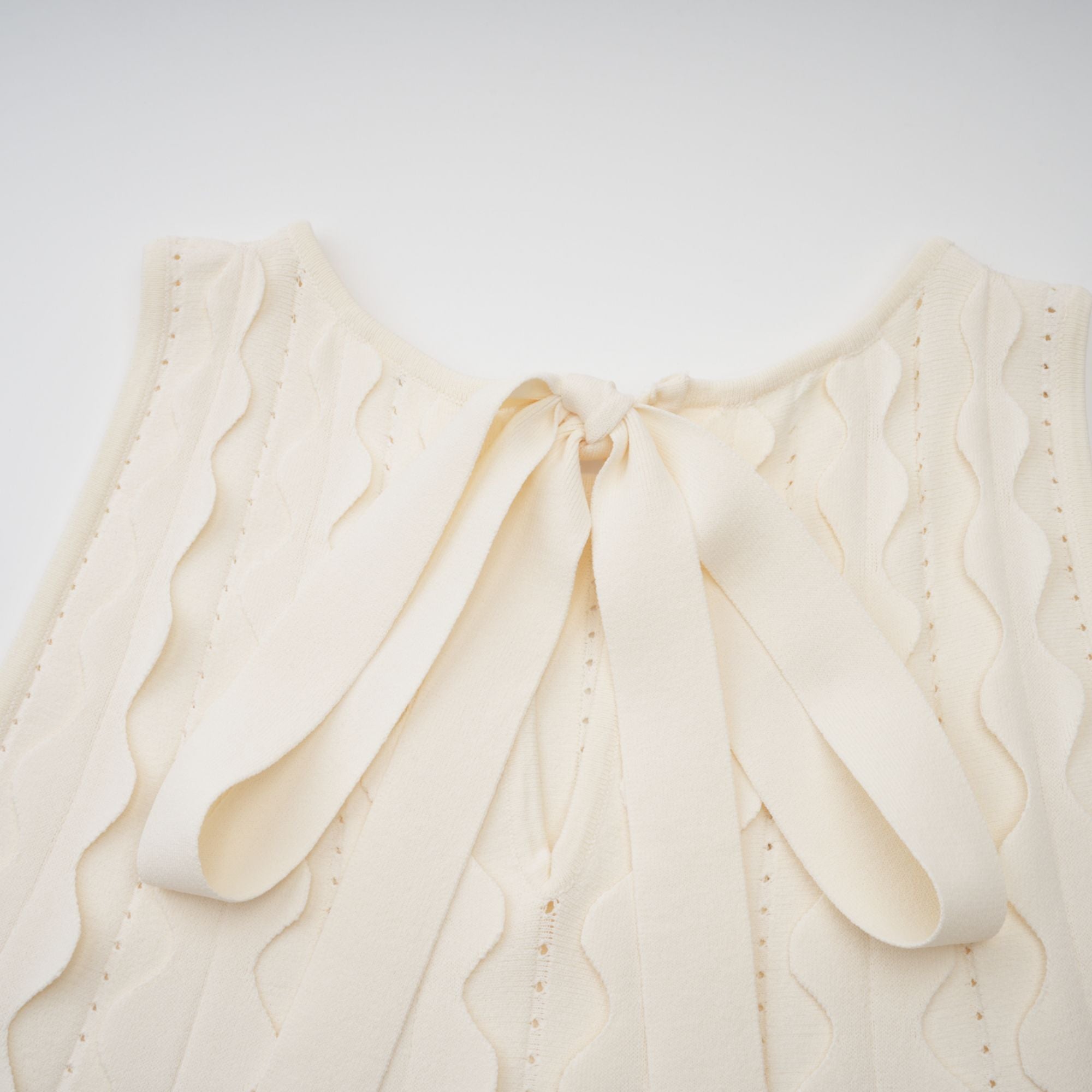 Axelle white wavy-detail sleeveless mini dress