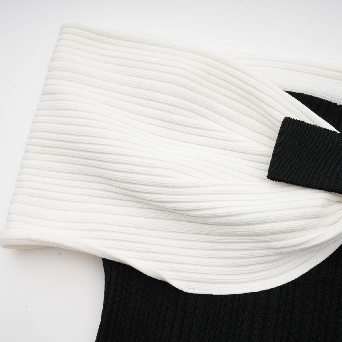 Angèle black off-shoulder knitted mini dress