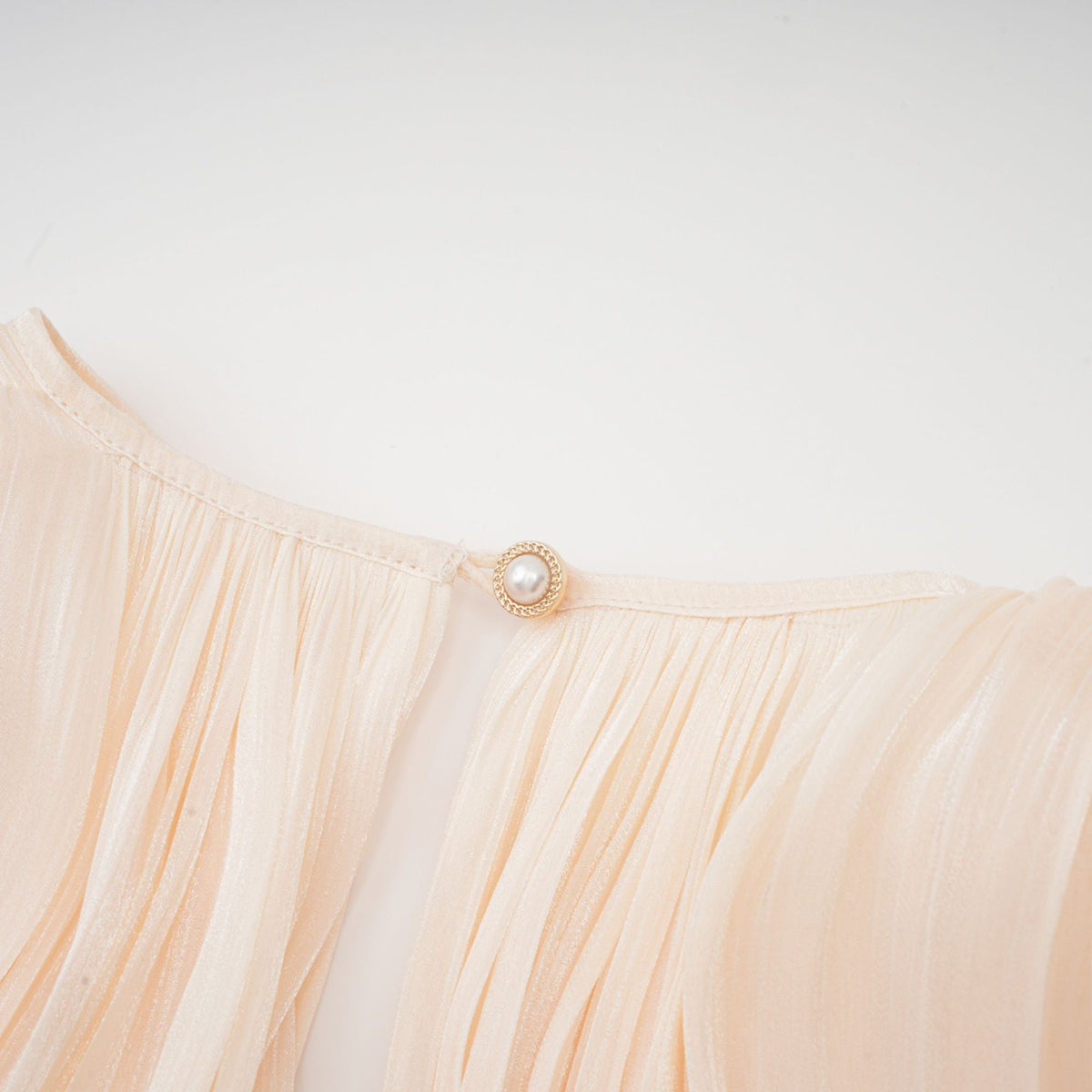 Eugénie fully-pleated ruffled mini dress in Neutrals