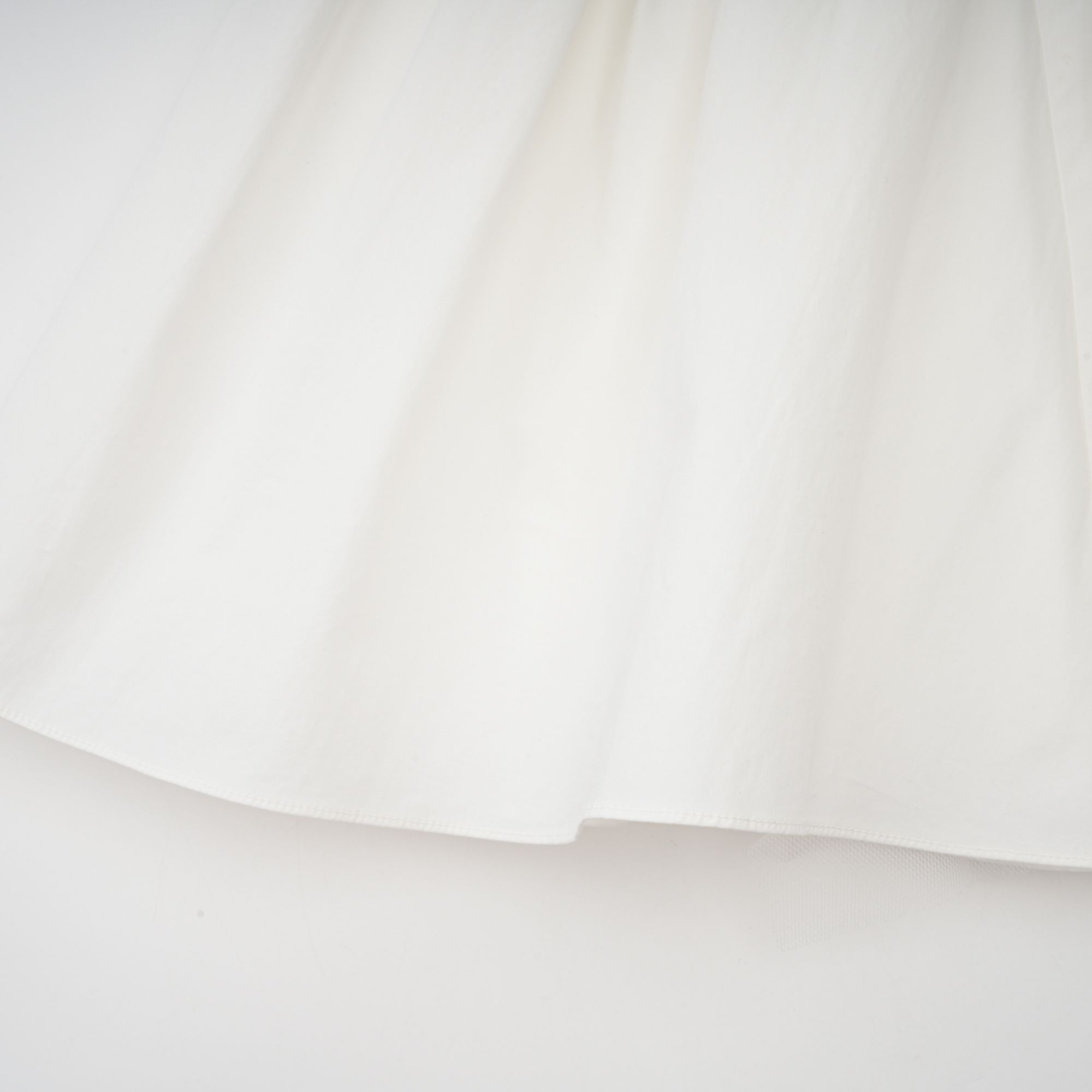 Julie white folded-neck bonded sleeveless mini dress