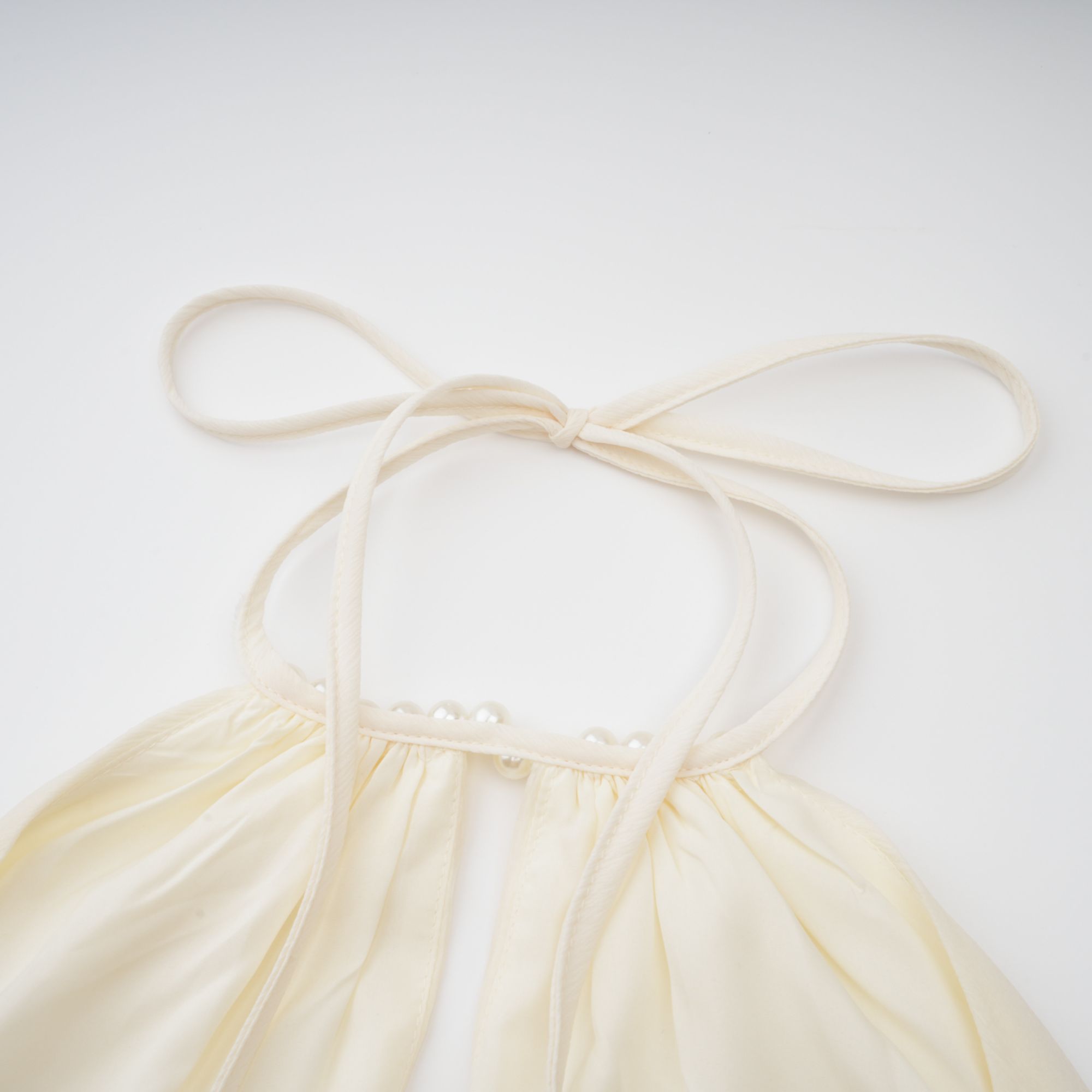 Bérénice white halterneck faux-pearl mini dress