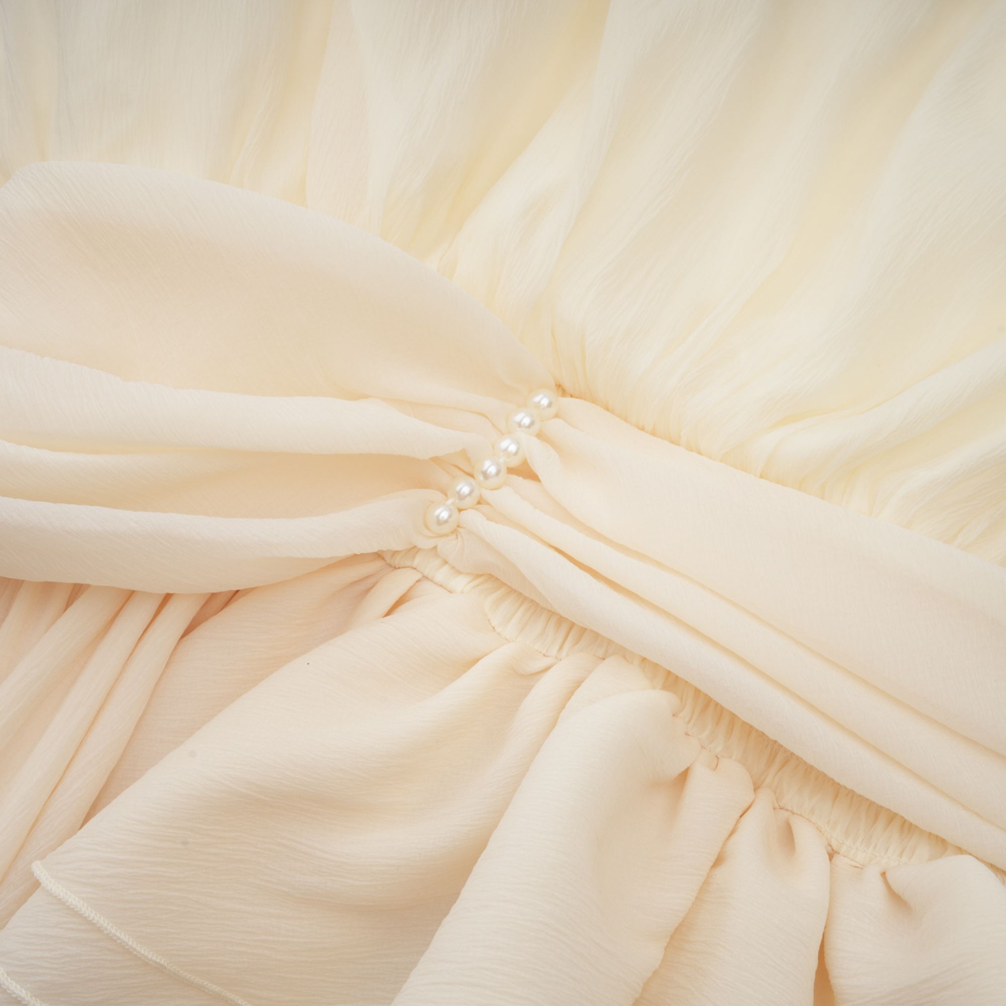 Bérénice white halterneck faux-pearl mini dress