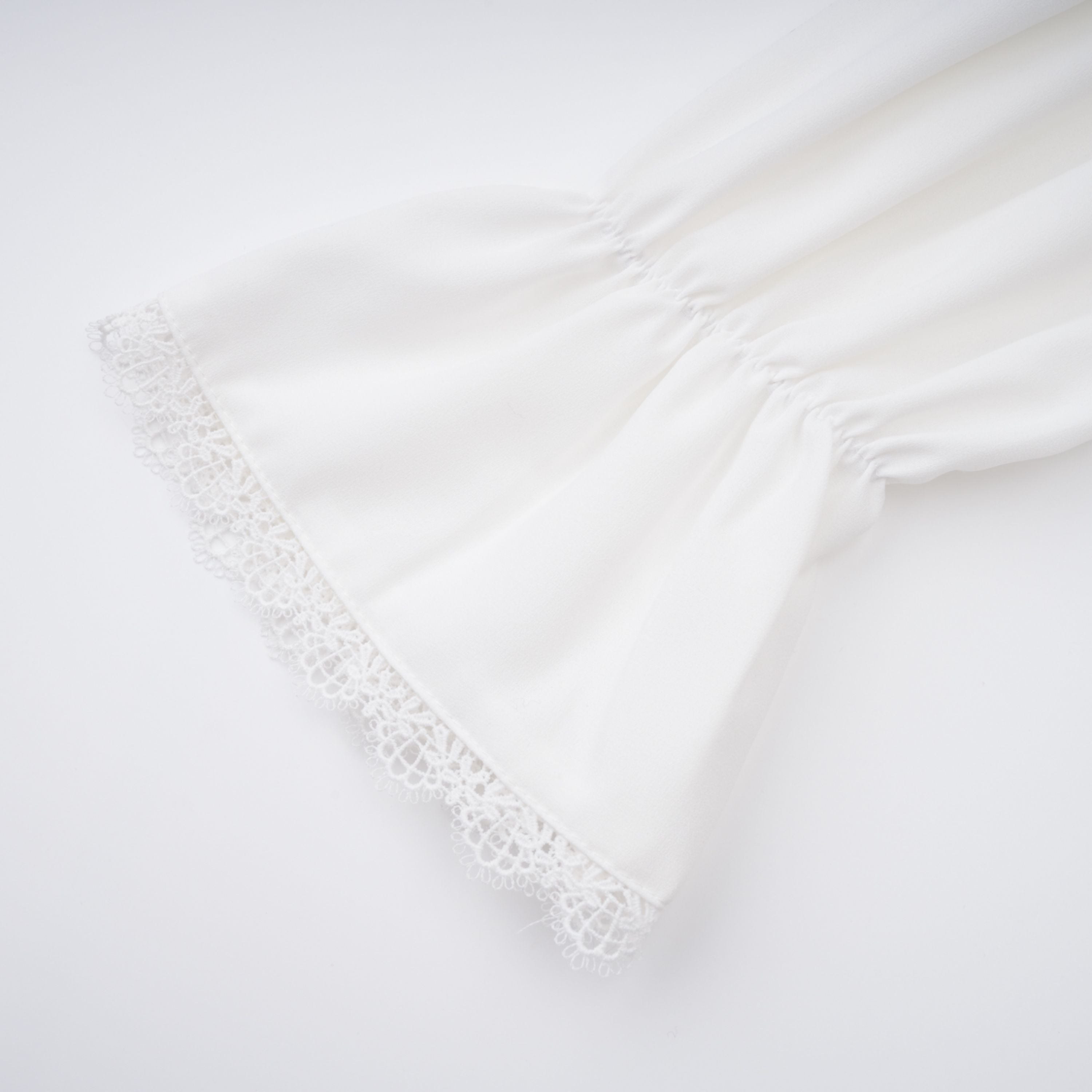 Paulette white bowknot shirred-panel ruffled shirt