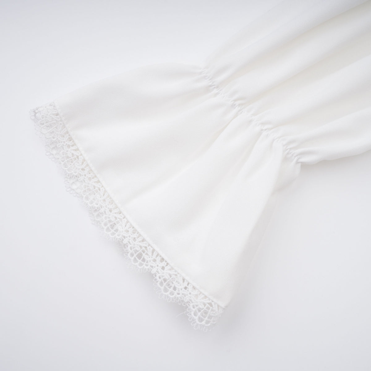 Paulette white bowknot shirred-panel ruffled shirt