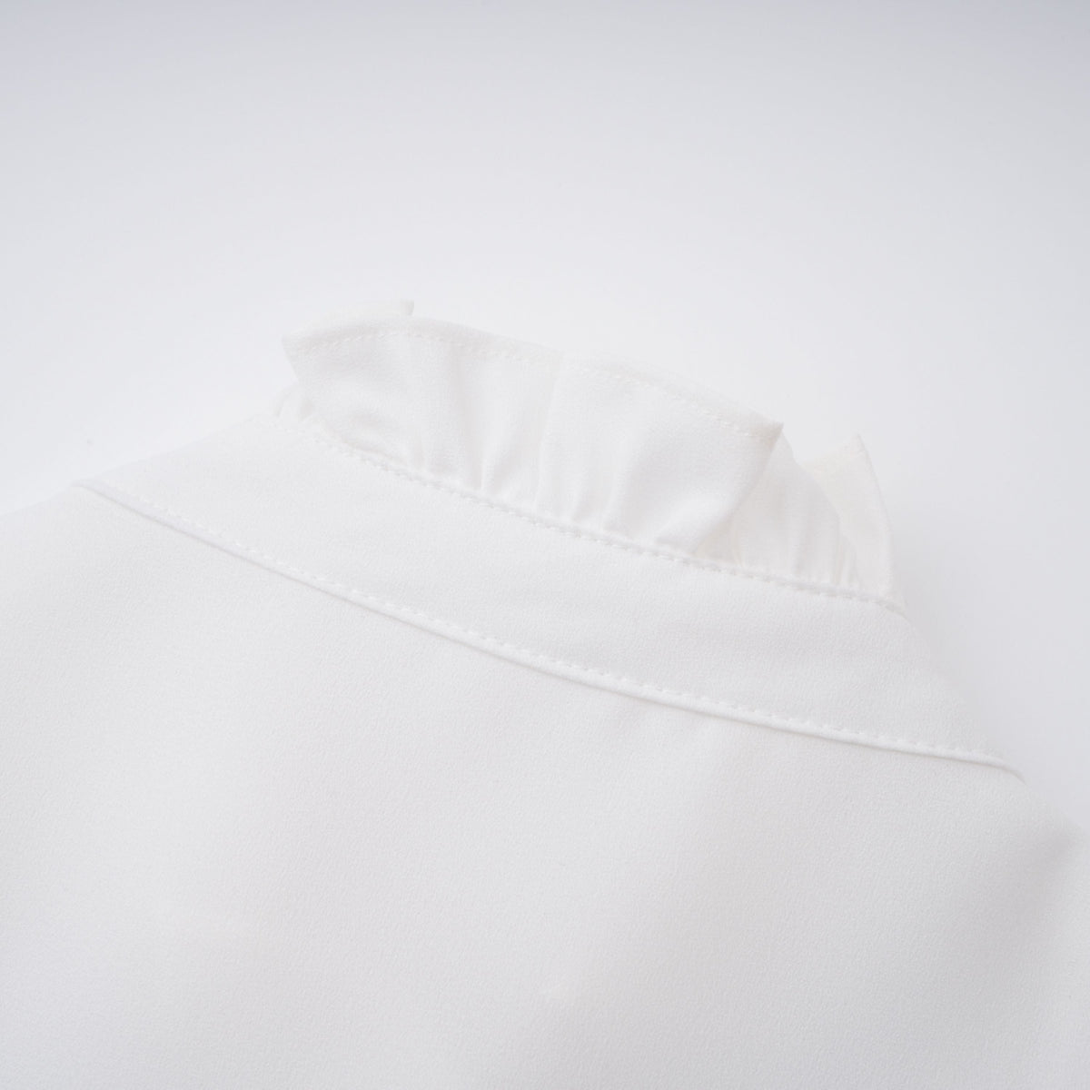 Paulette white bowknot shirred-panel ruffled shirt