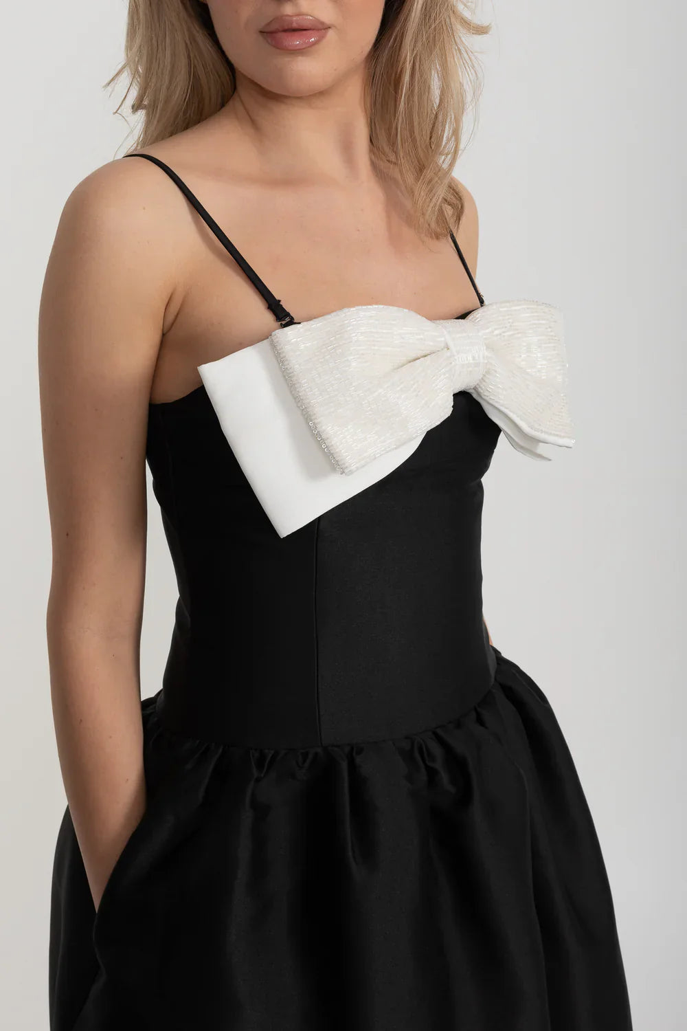 Fitted Sleeveless Mini Dress With Prominent Large White Bow - Black