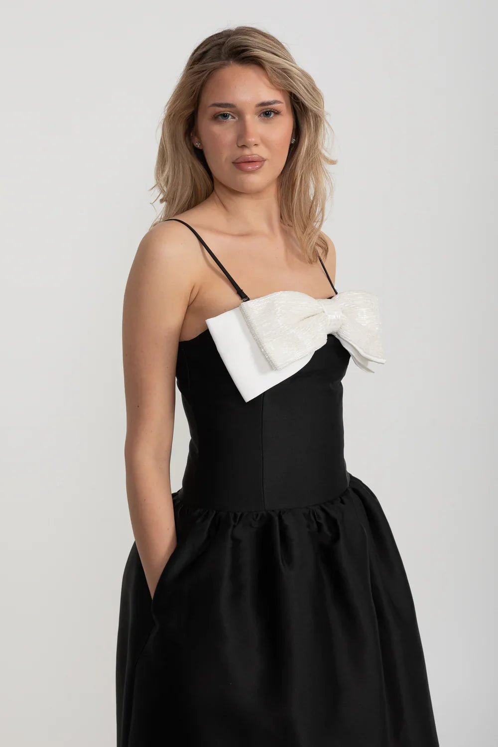 Fitted Sleeveless Mini Dress With Prominent Large White Bow - Black
