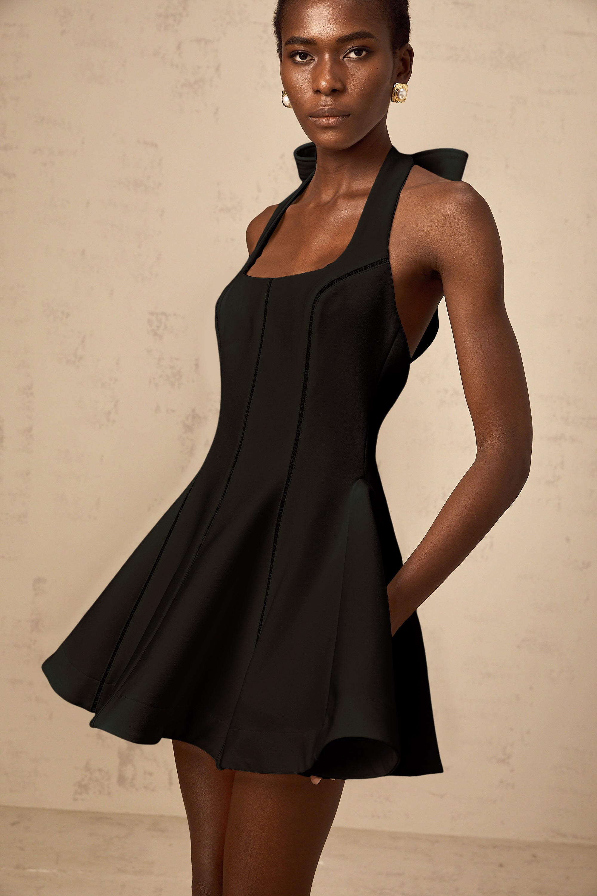 Quirine halterneck bow-detail mini dress in Black