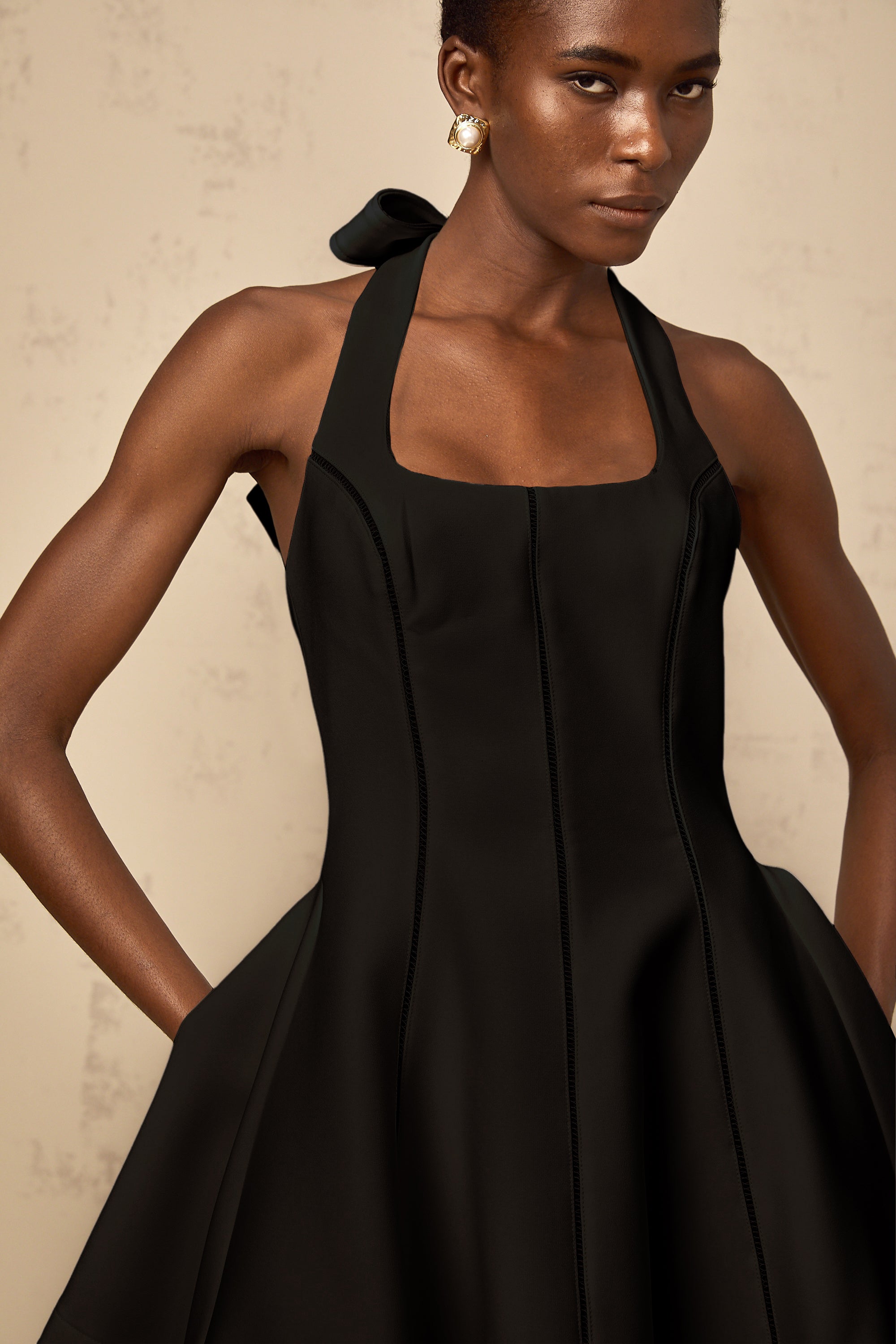 Quirine halterneck bow-detail mini dress in Black