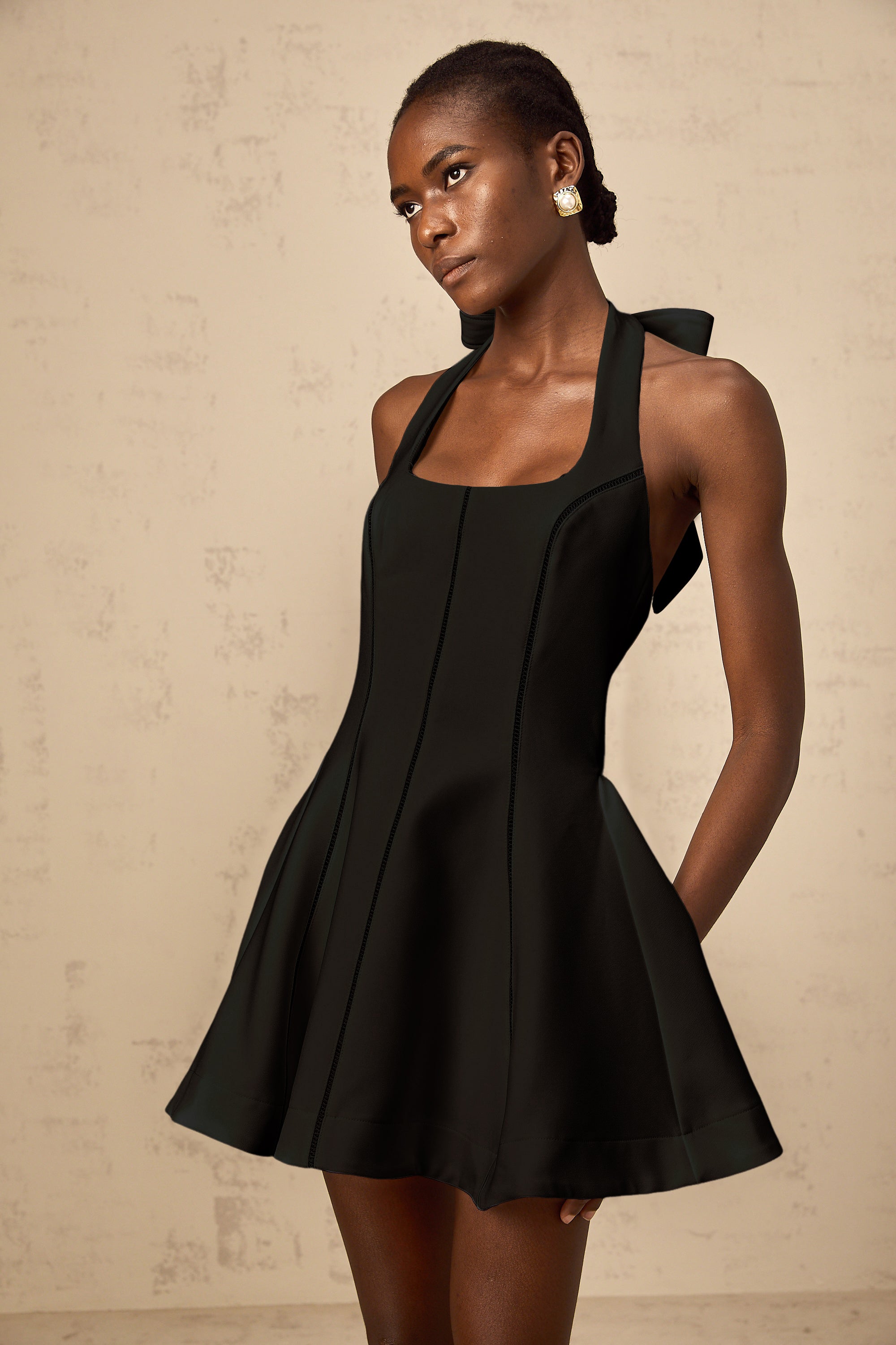 Quirine halterneck bow-detail mini dress in Black