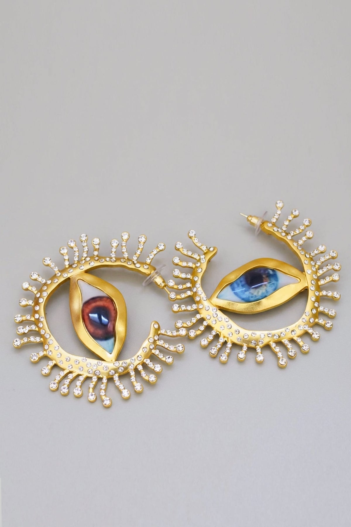 Statement Eye Stud Earrings with Crystal Ray Details – Gold
