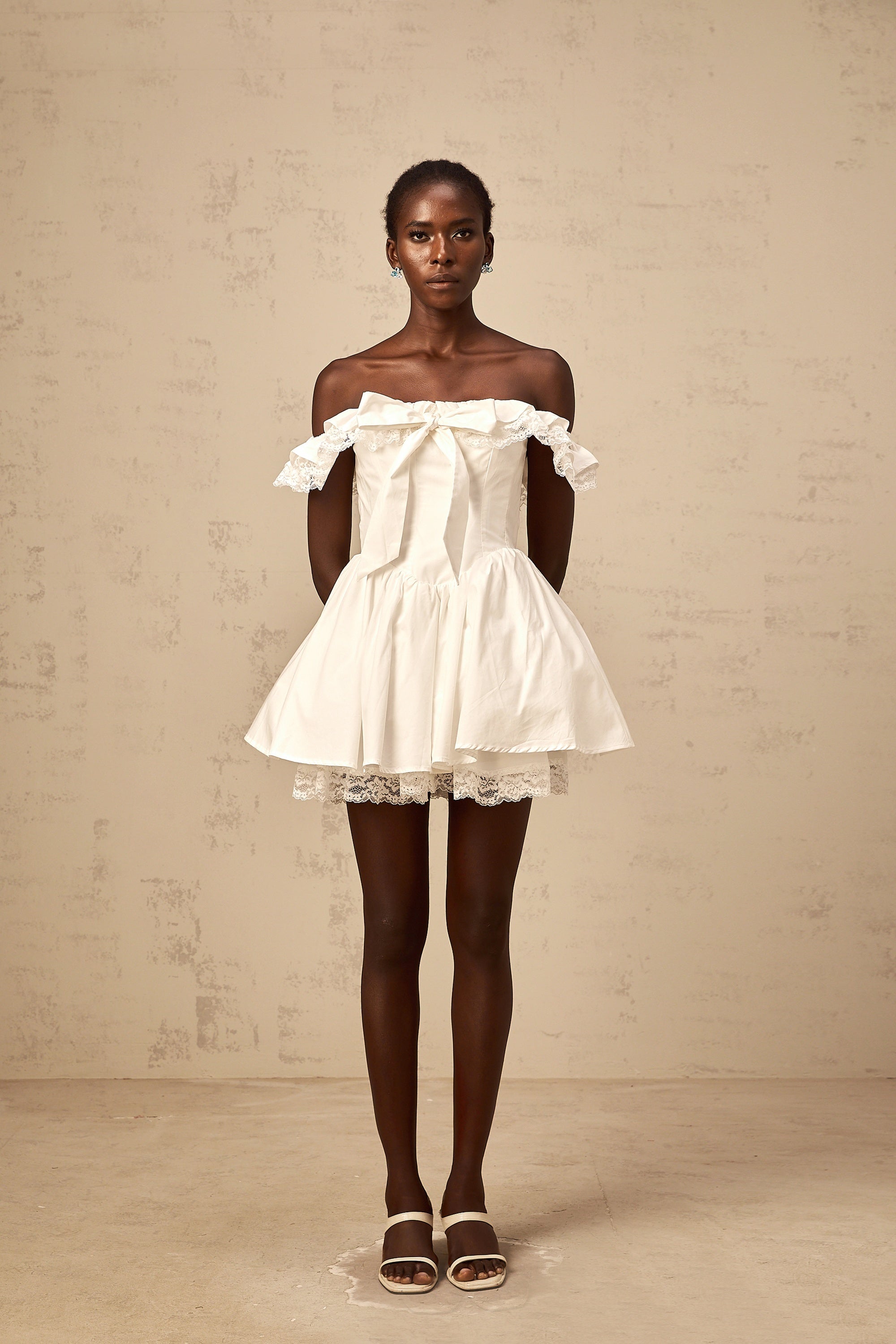 Arsène white oversize-bow ruffled mini dress