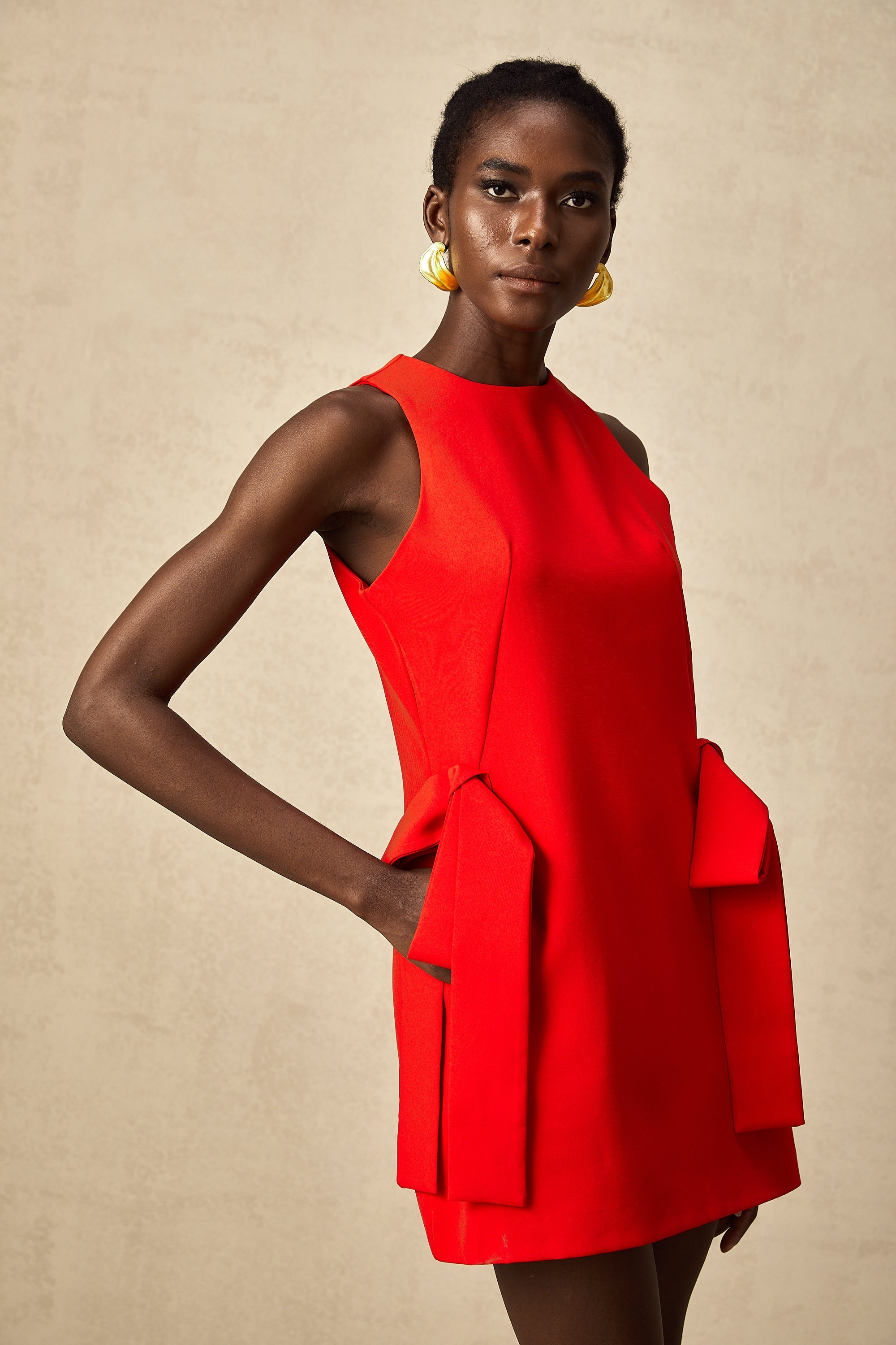 Ronnie red sleeveless bow mini dress