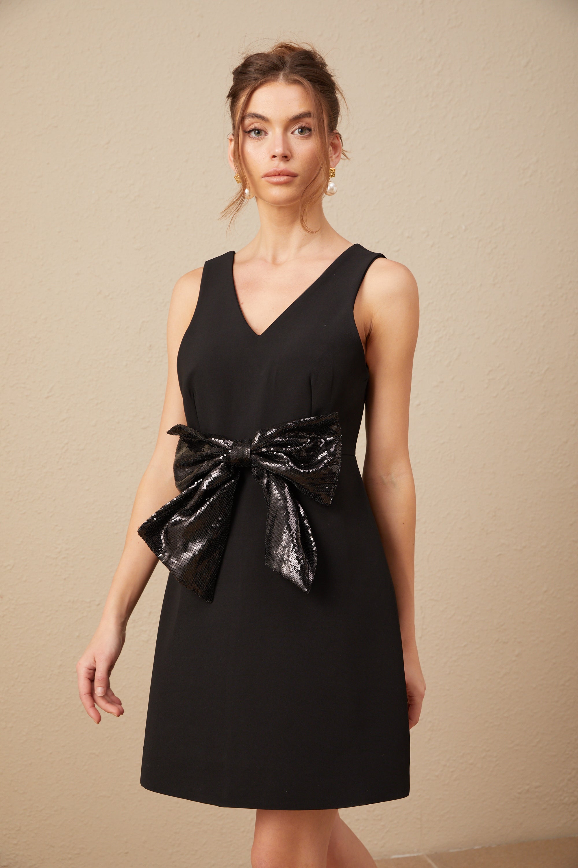 Roxane V-neck sequin-bow mini dress in Black (US Only)