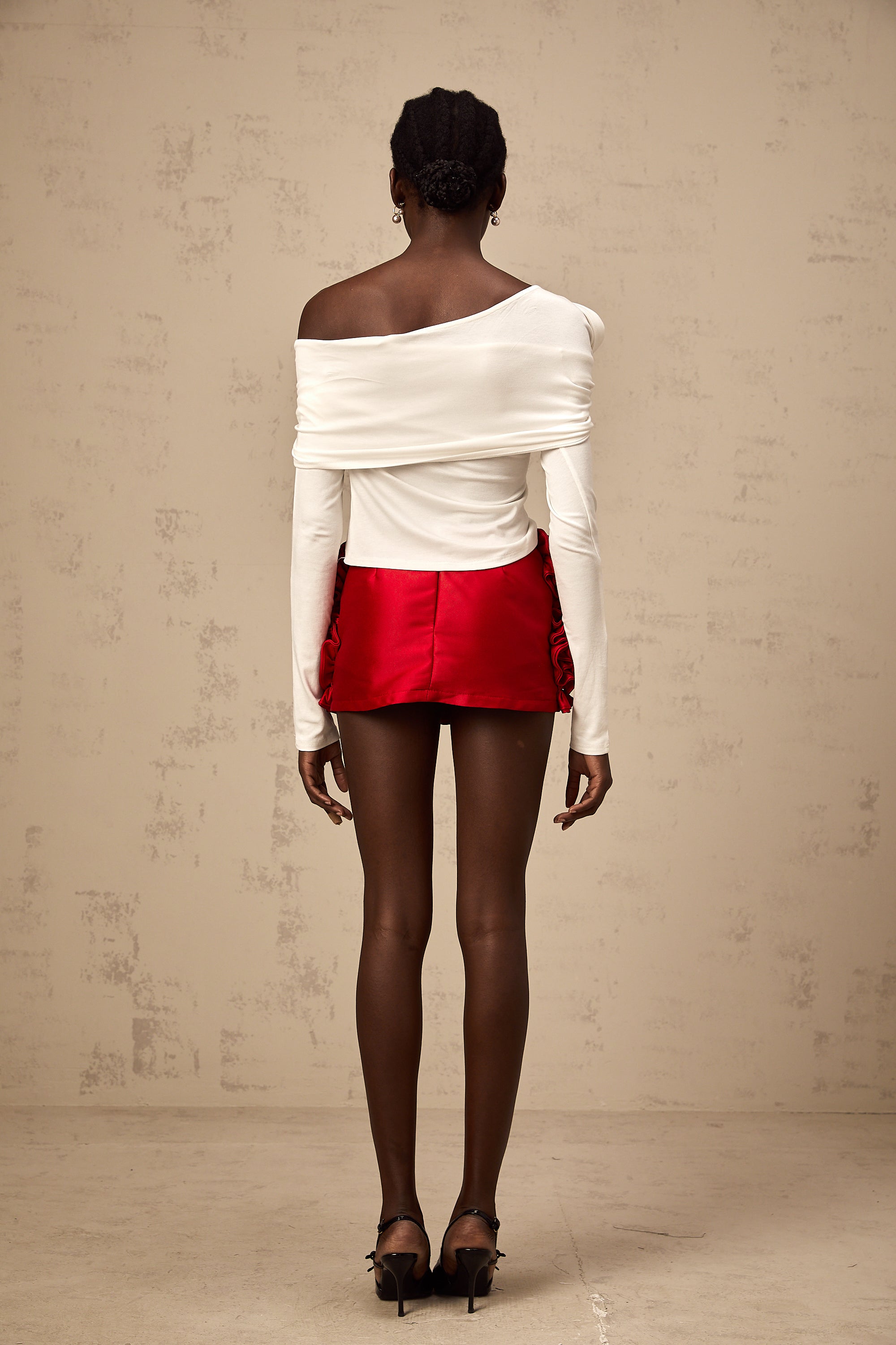 Zoéline white asymmetrical twisted jersey top