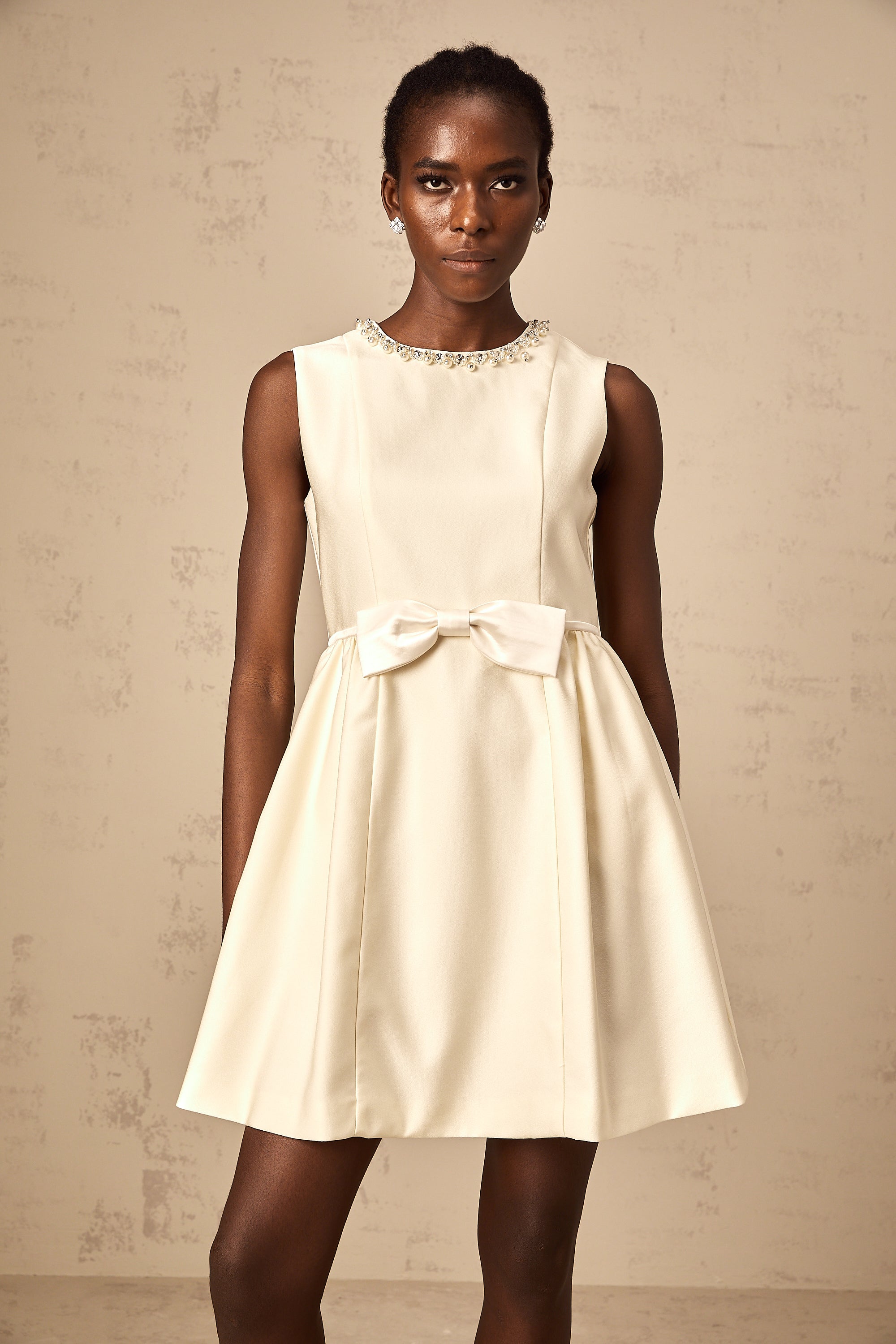 Isabelle white bowknot embellished mini dress