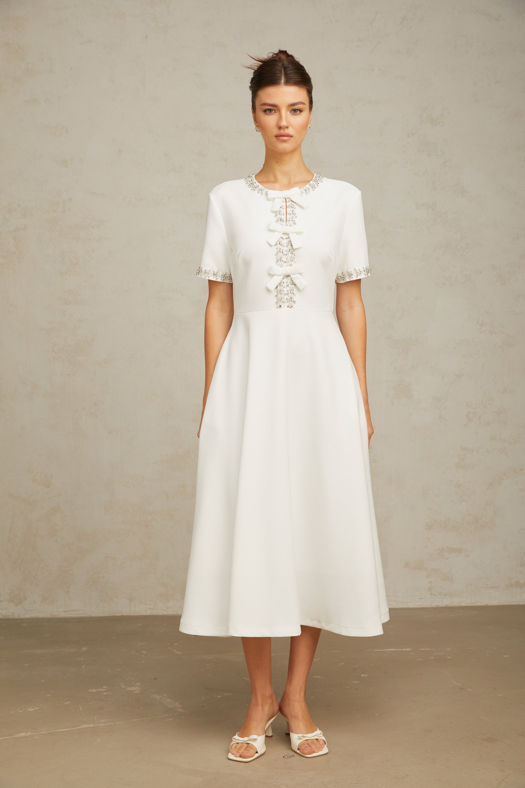 Cassiopeia crystal-accented bow midi dress in White