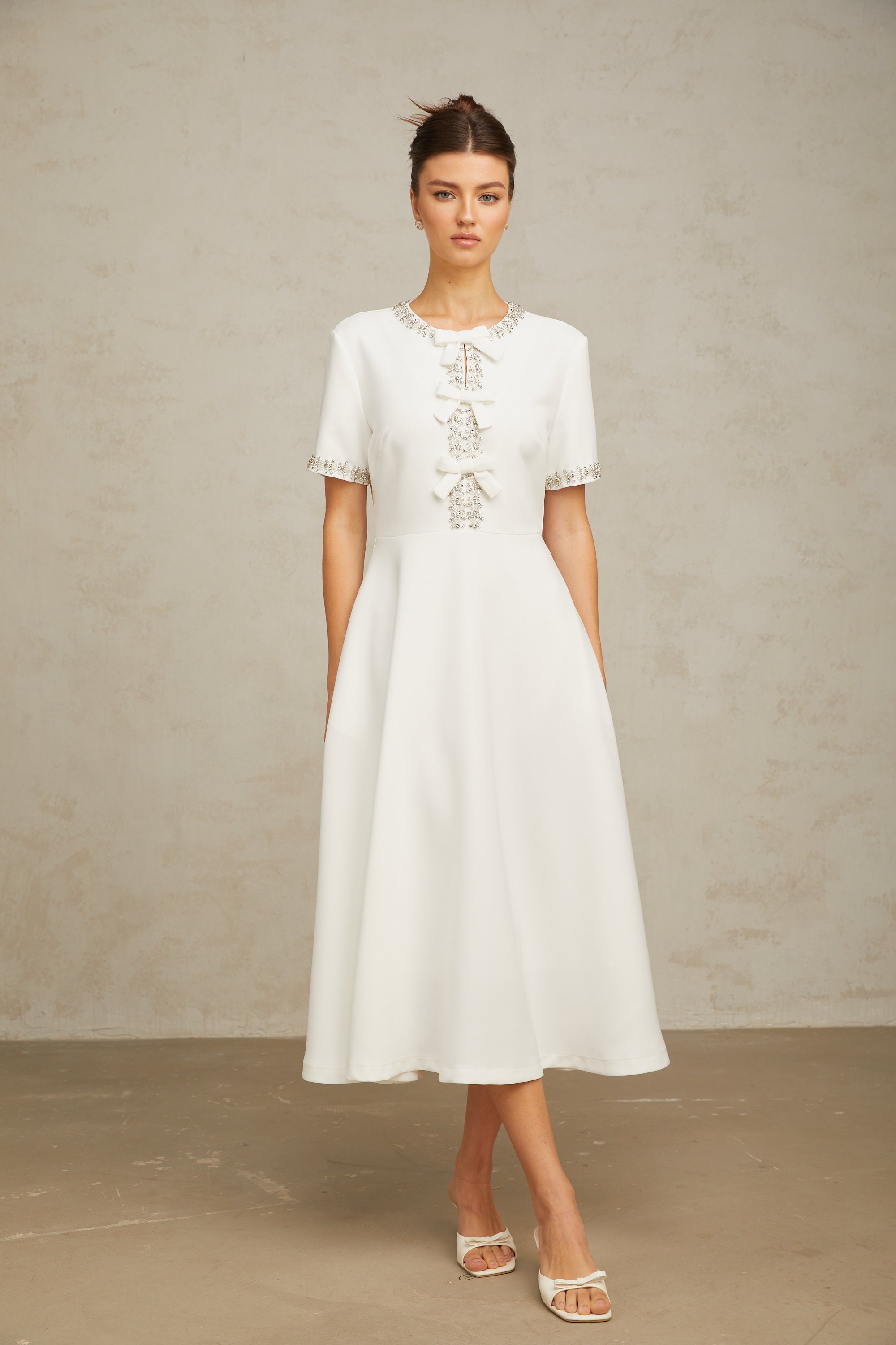 Cassiopeia crystal-accented bow midi dress in White